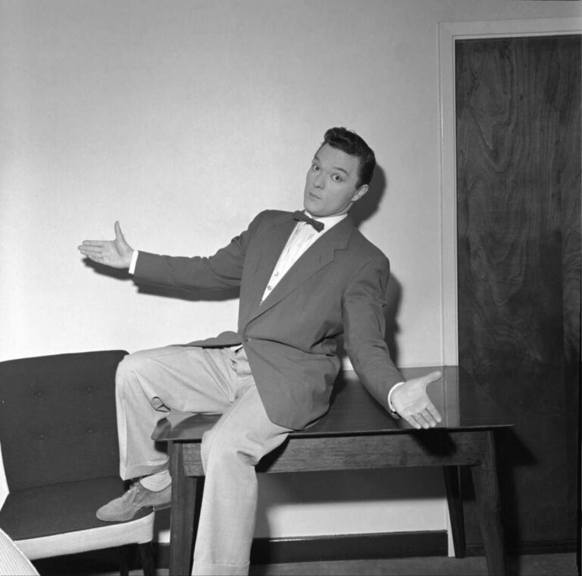 Man in Suit Posing on Table
