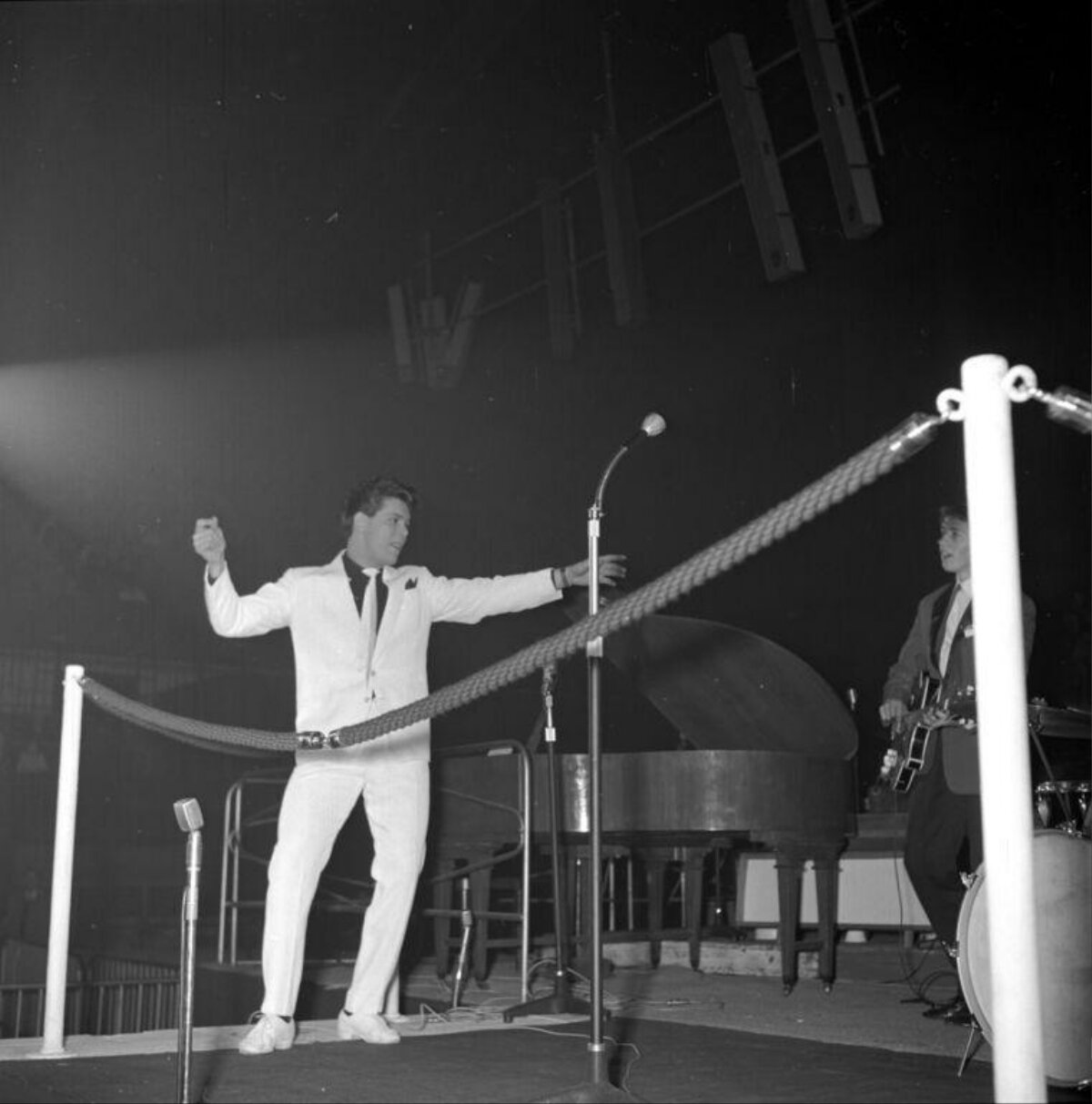 Lead Singer Performing on Concert Stage