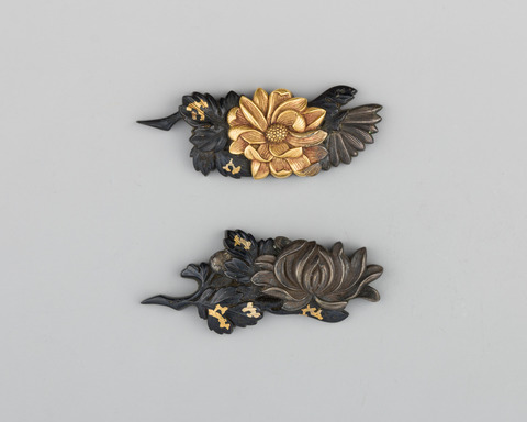 Pair of Carved Floral Metal Ornaments
