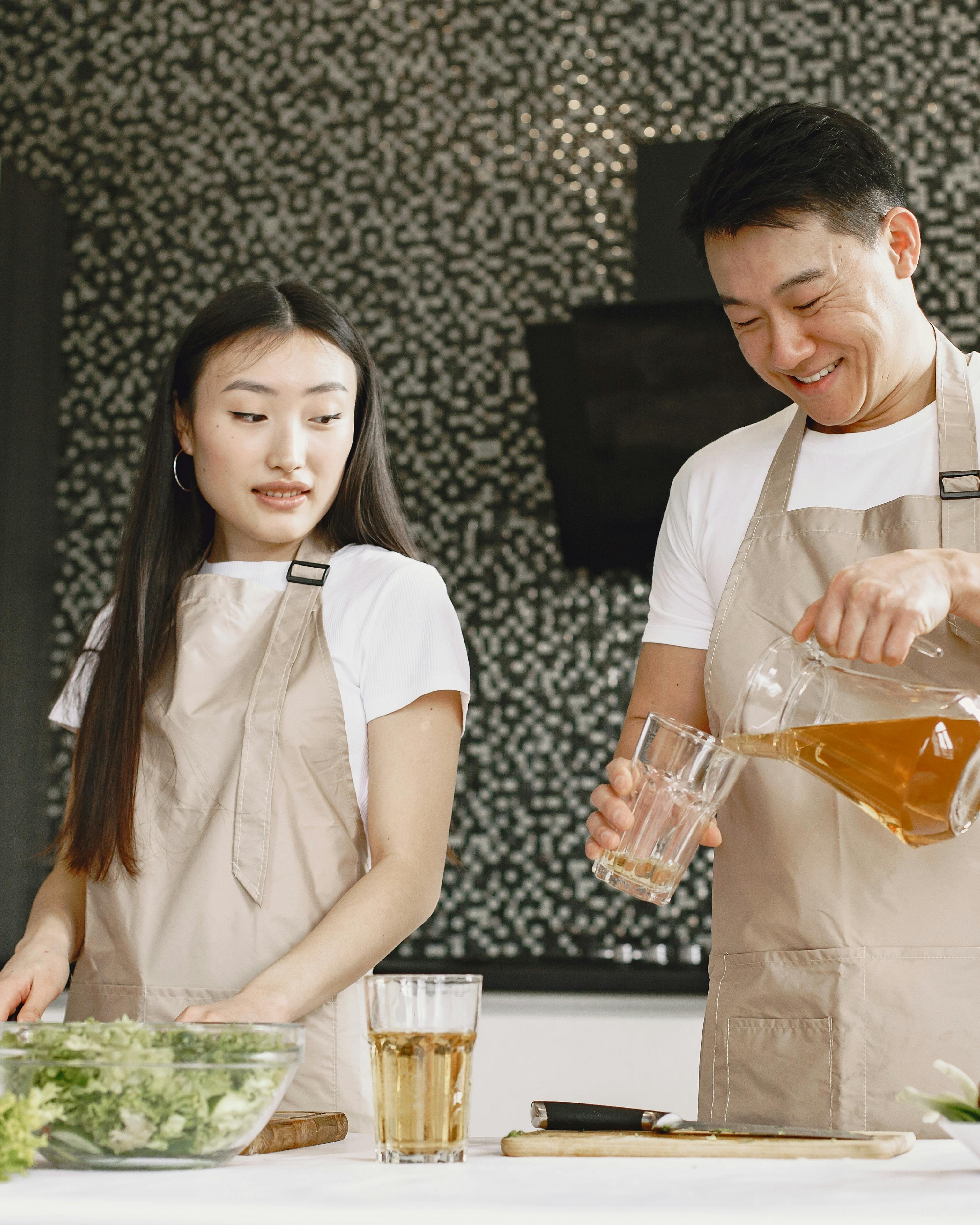 Couple Cooking Together in Kitchen