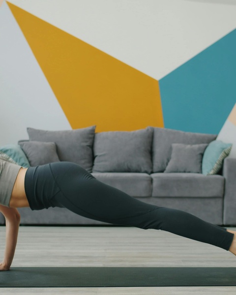 Person Doing Plank Exercise at Home