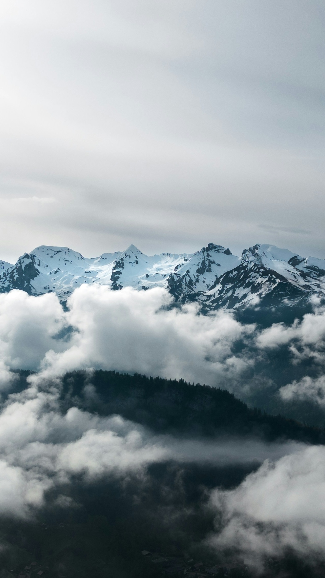 Snow-Capped Mountains Above Clouds