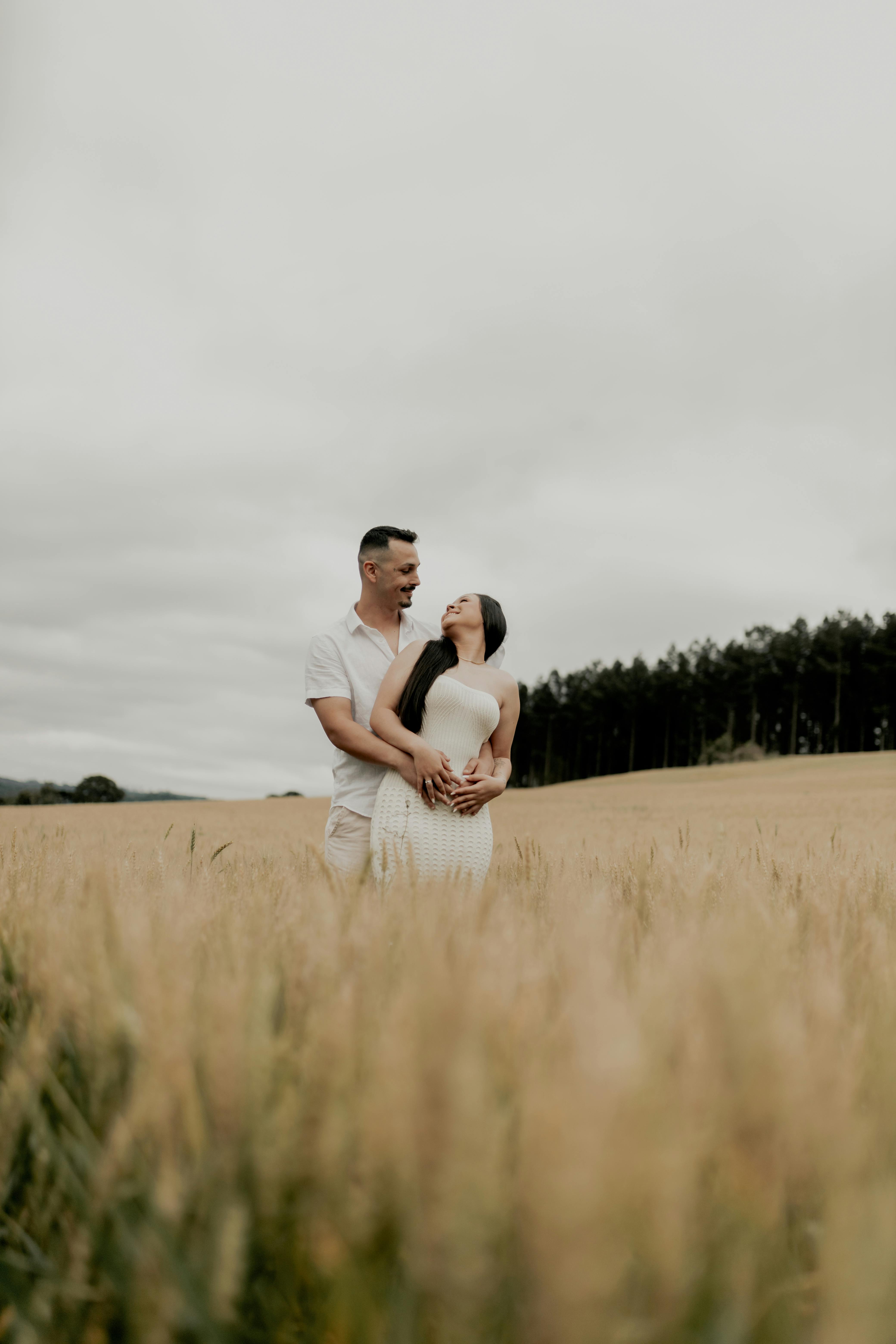 Couple Embracing in Golden Wheat Field