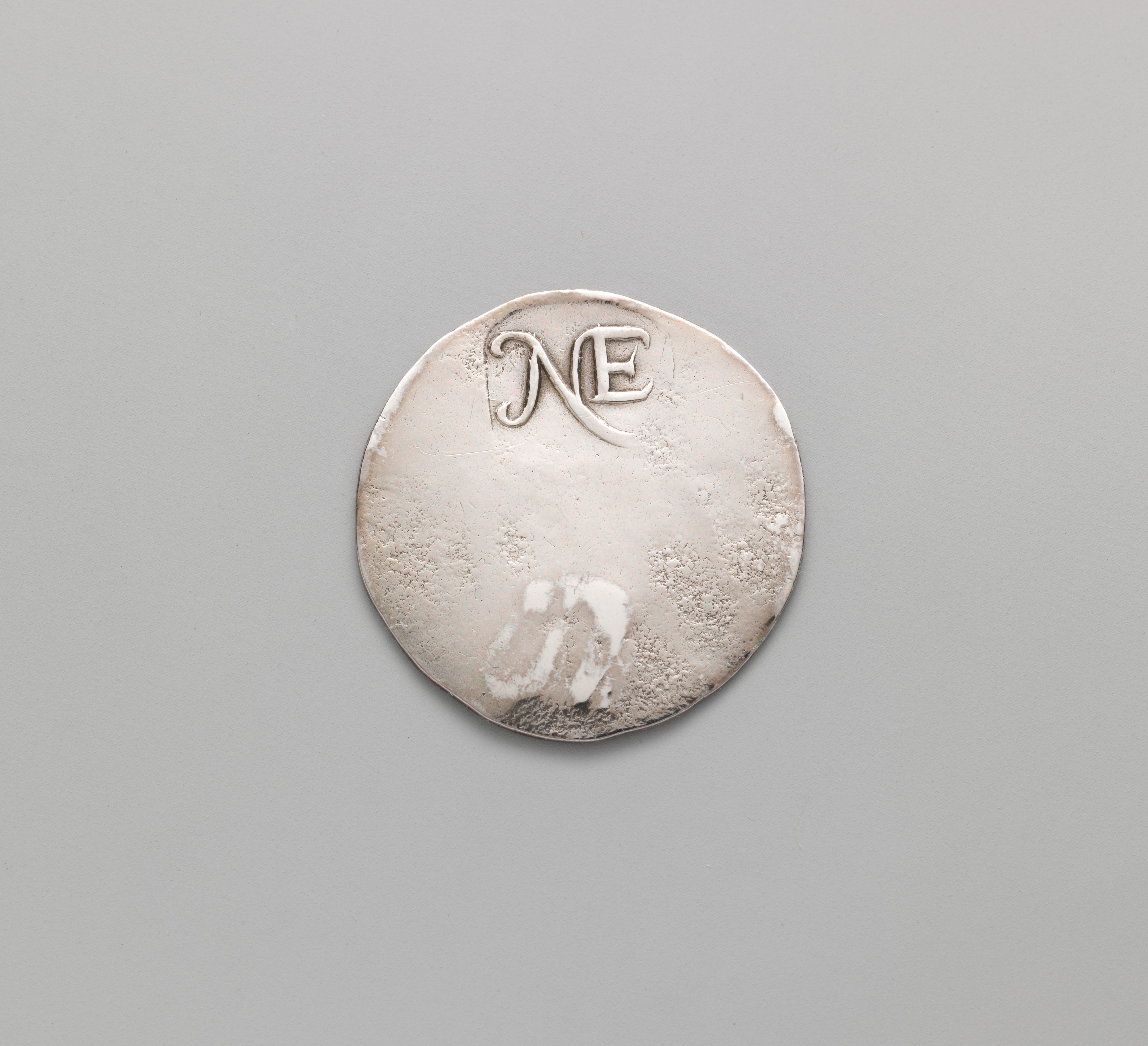 Silver Token with NE Monogram