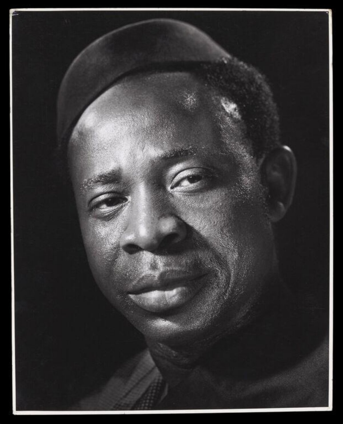 Studio Portrait of Black Man in Fez
