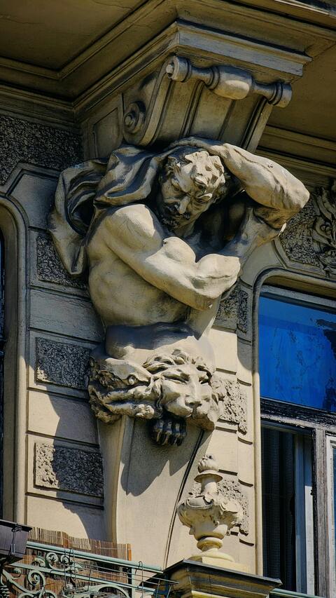 Stone Atlante Sculpture on Building Facade