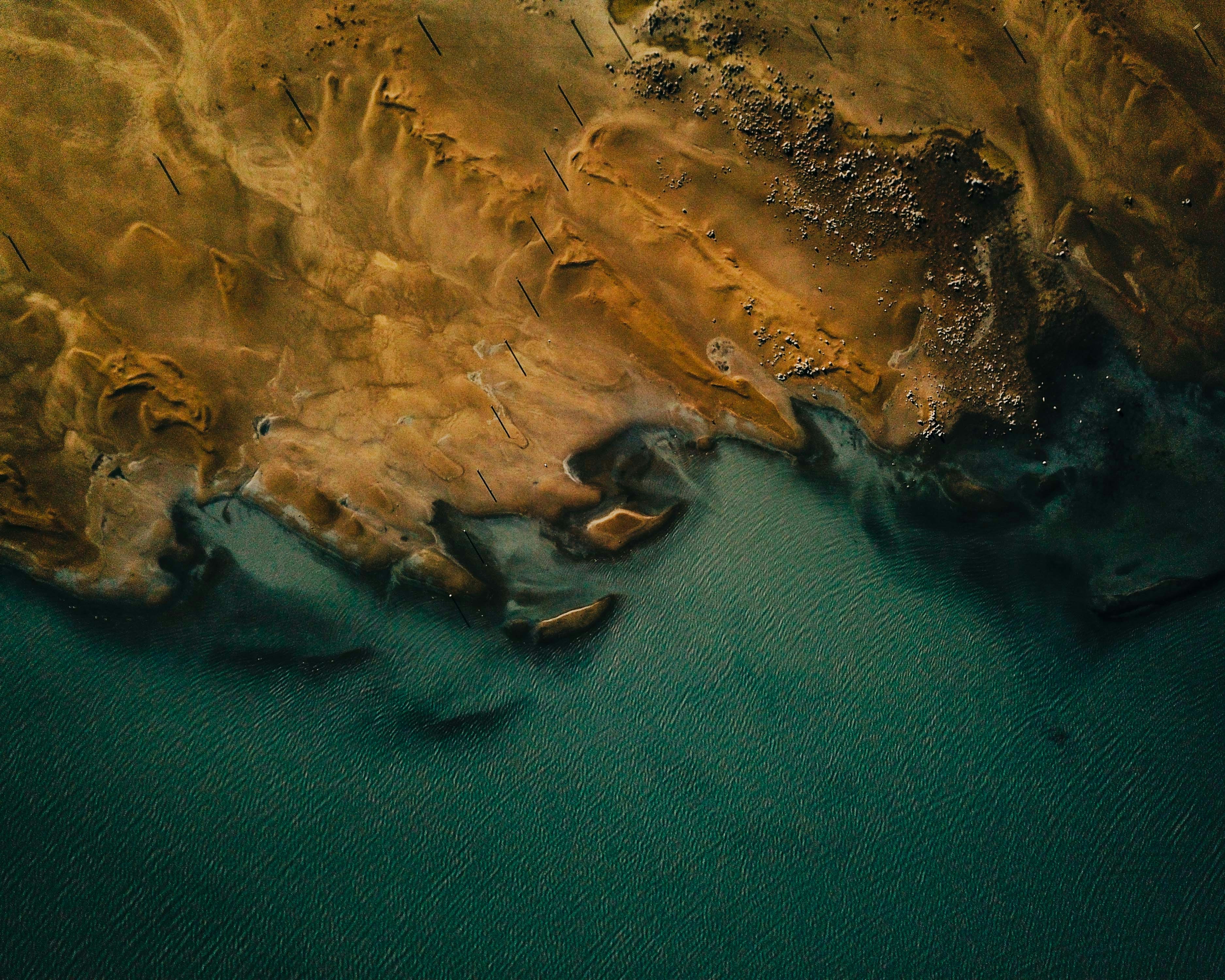 Aerial View of Coastal Land and Sea