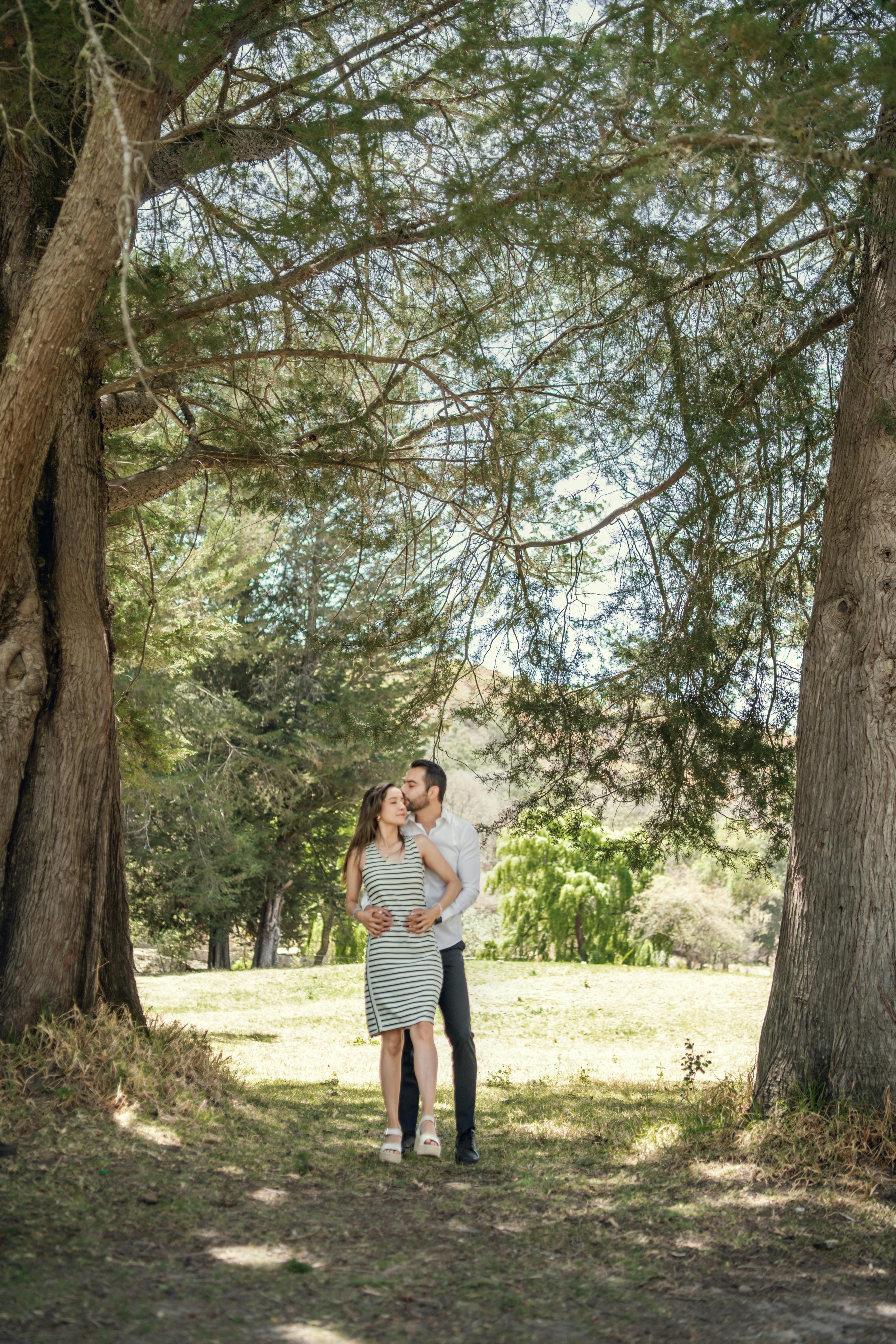 Couple Embracing in Sunny Park