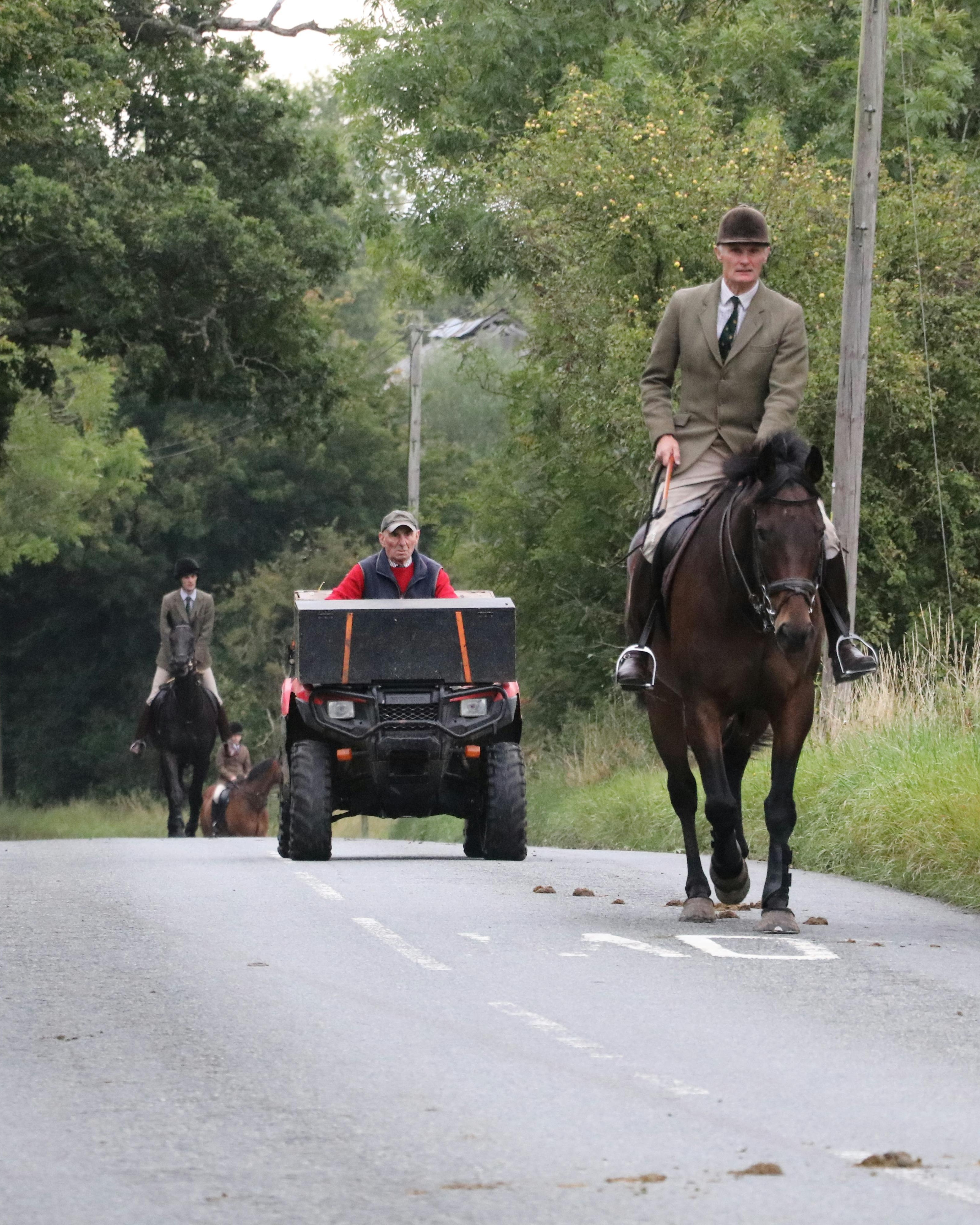 Equestrian Riders and ATV on Country Road