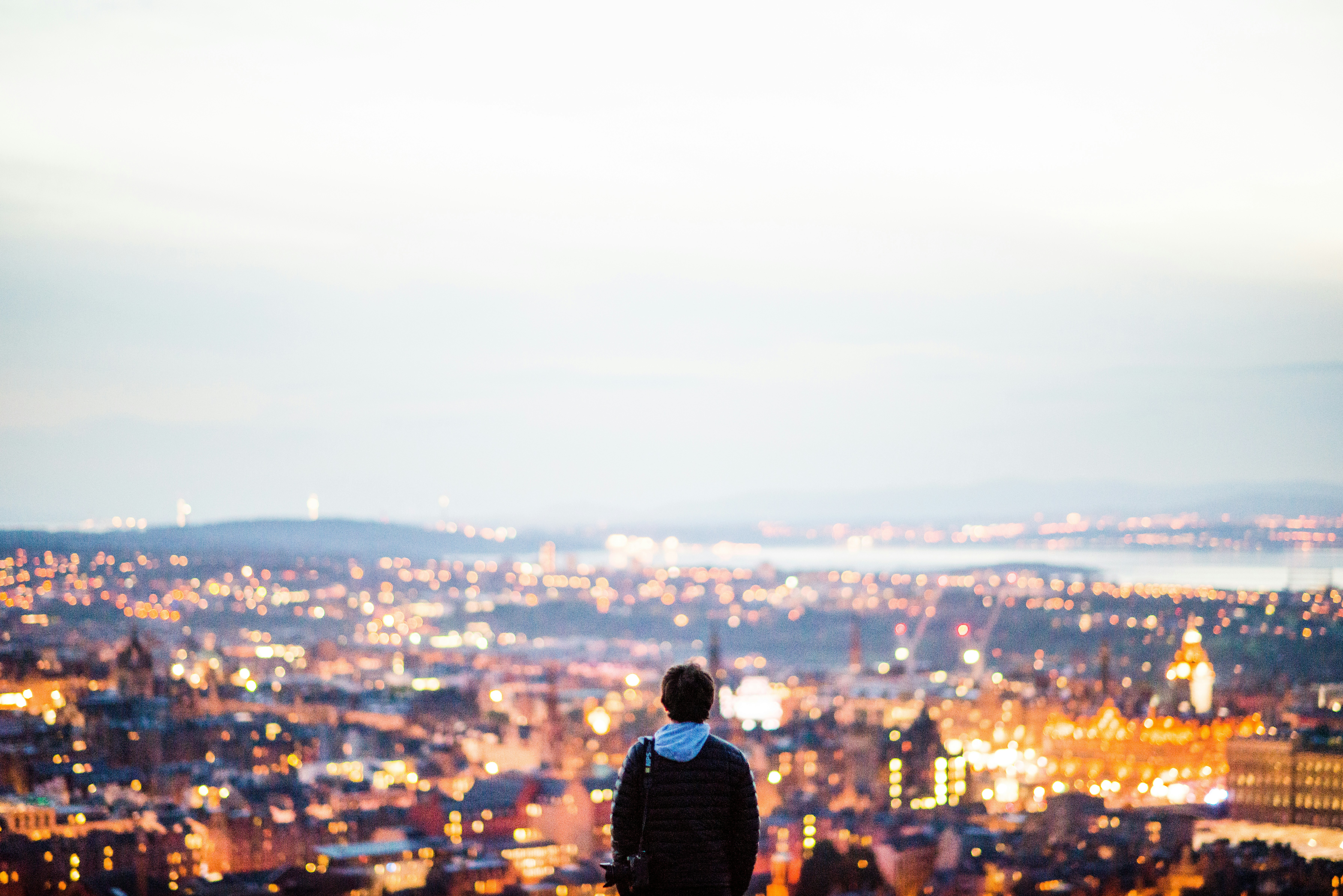 Person Overlooking Dusk City View