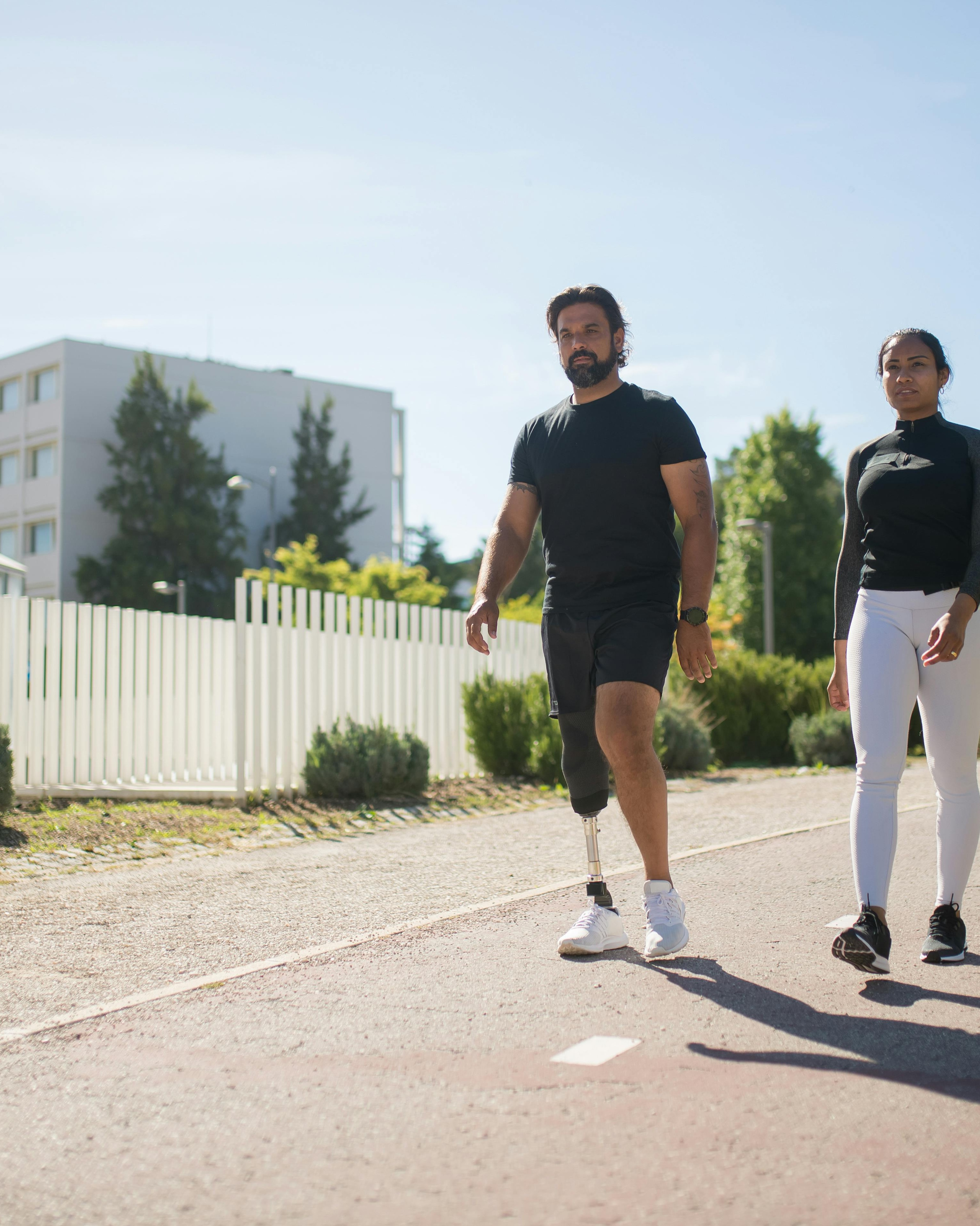 Man with Prosthetic Leg Walking Outdoors