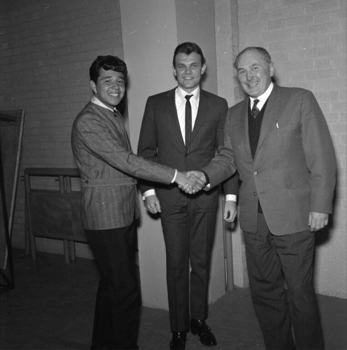 Three Men Shaking Hands
