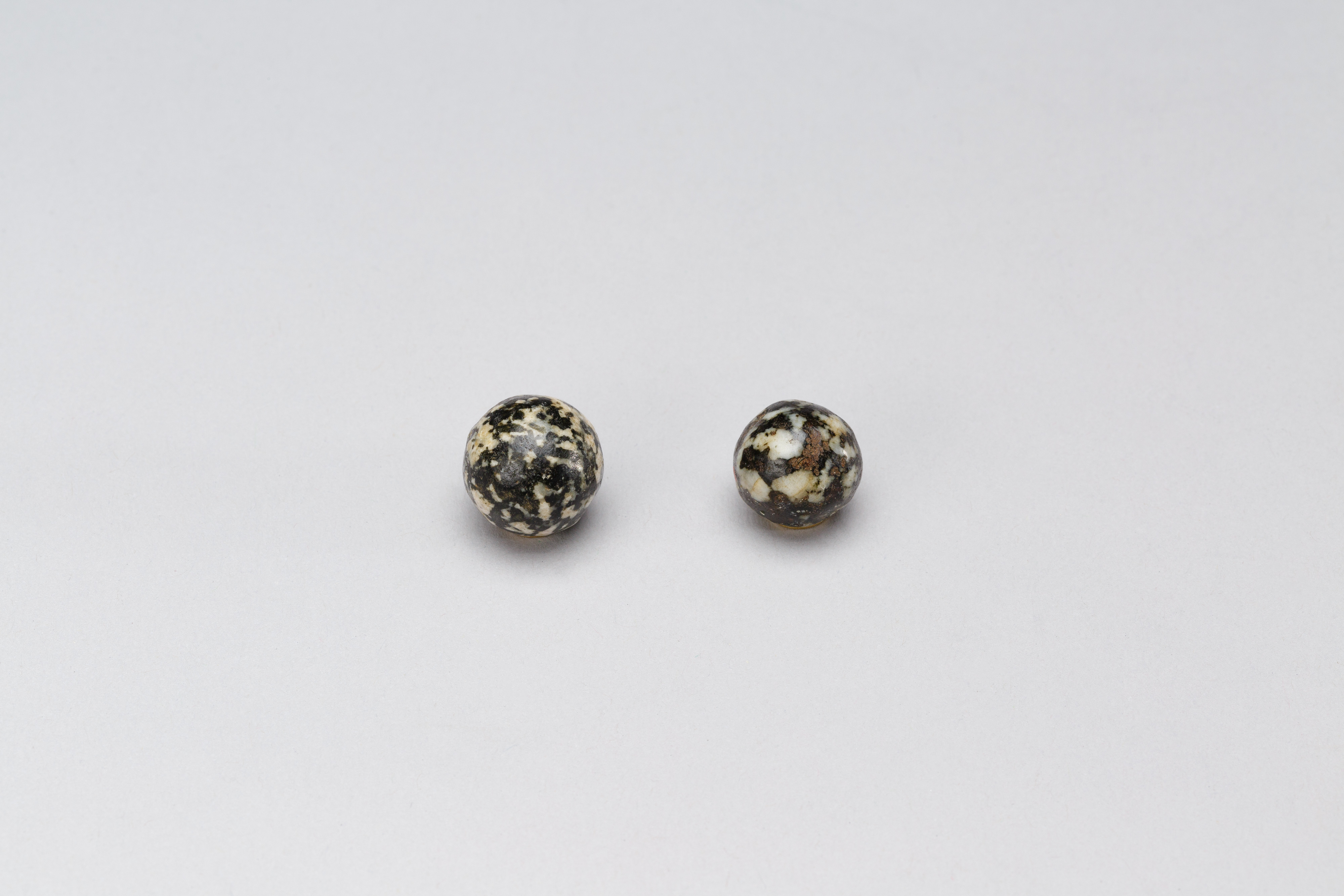 Two Speckled Stone Spheres