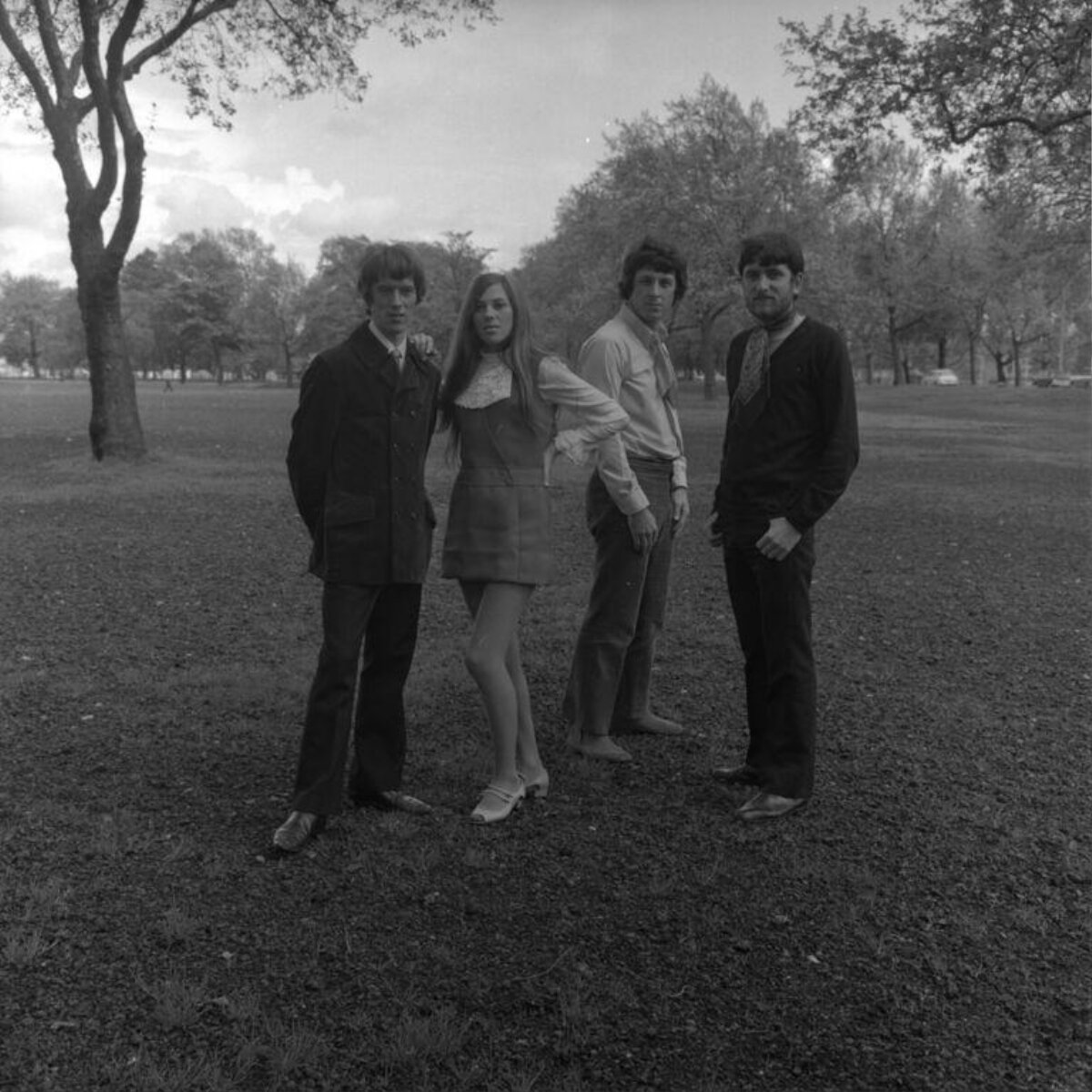 Four people portrait in city park