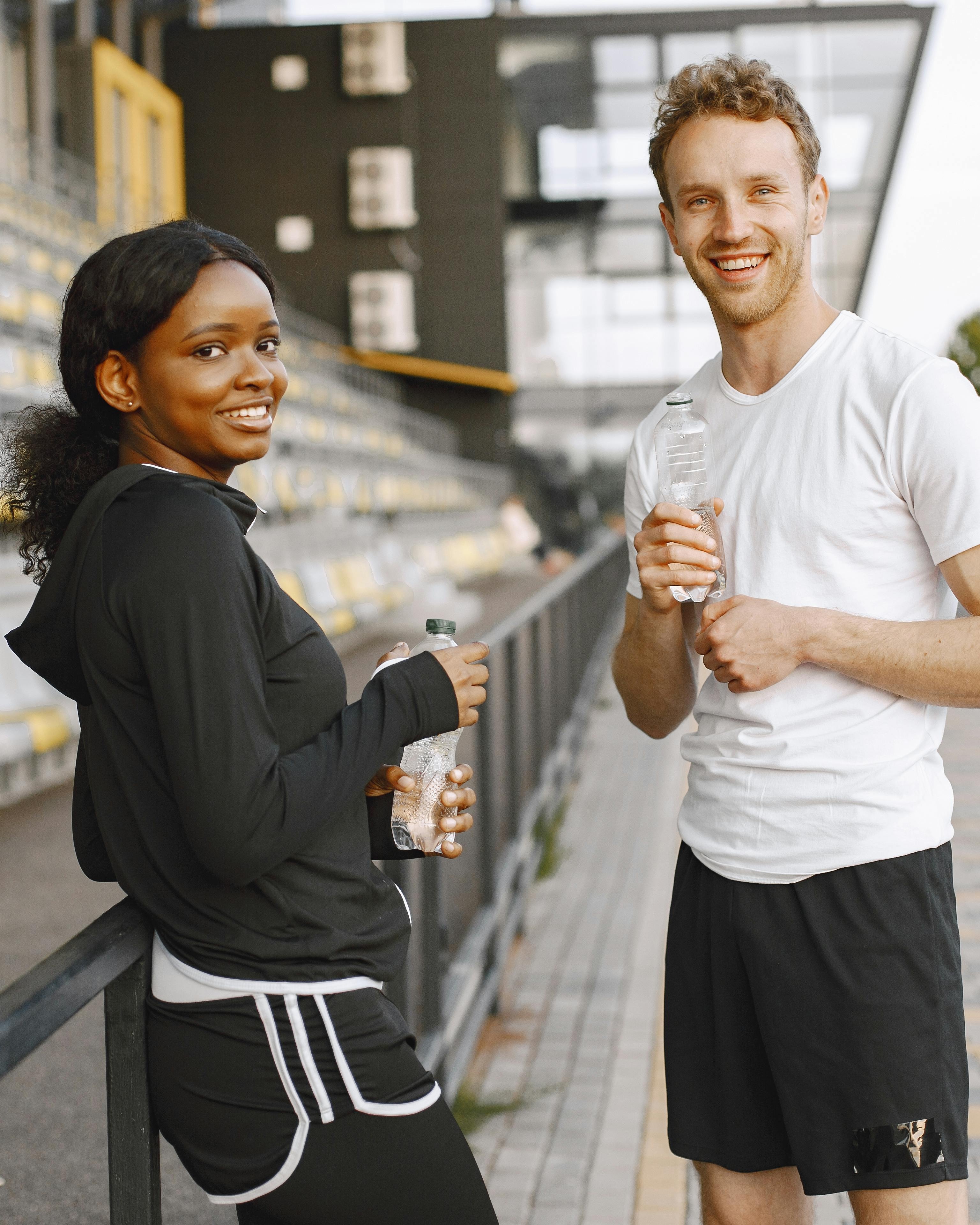 Two Fit People Resting After Workout