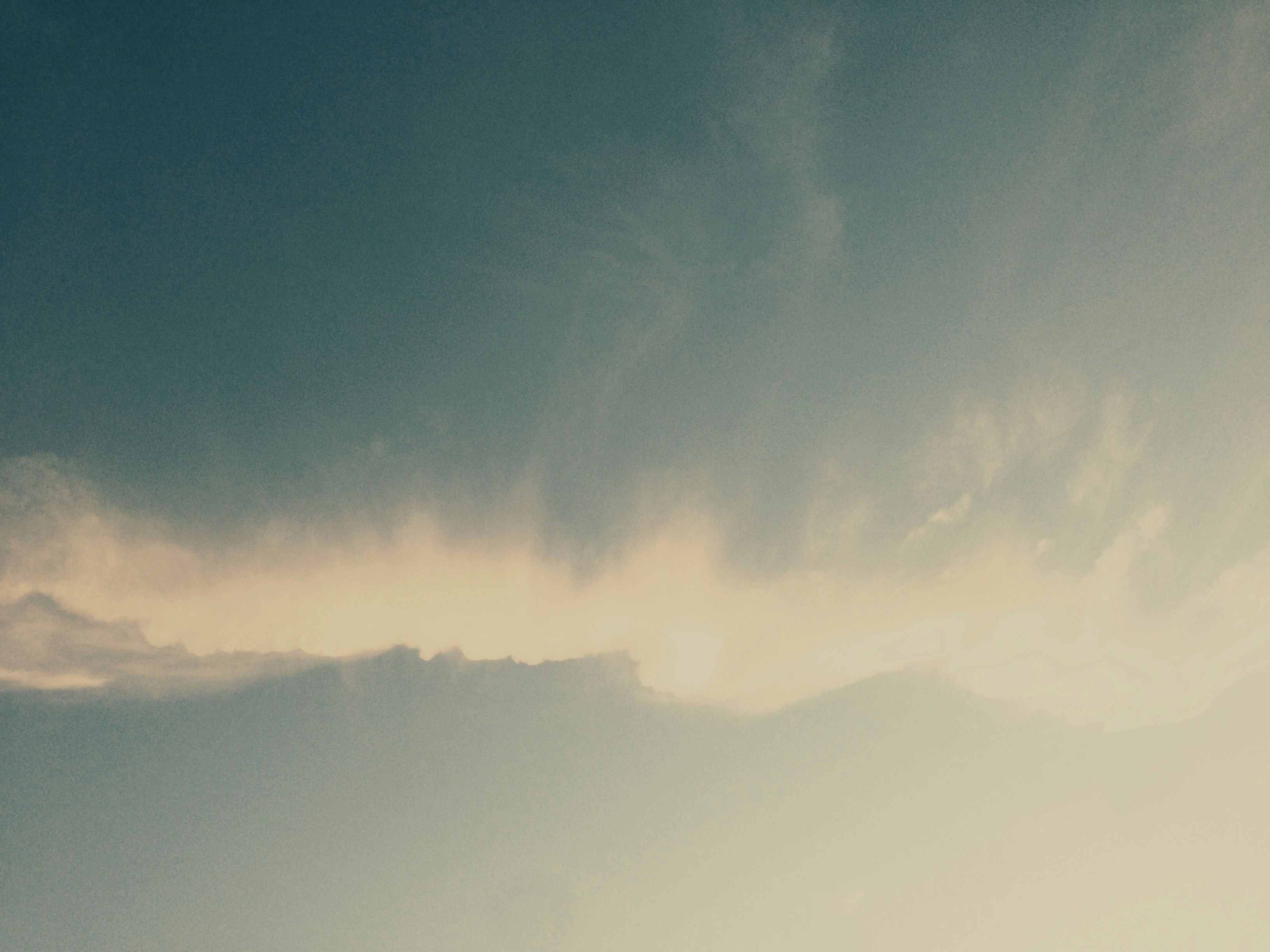 Sun Hidden Behind Layered Clouds