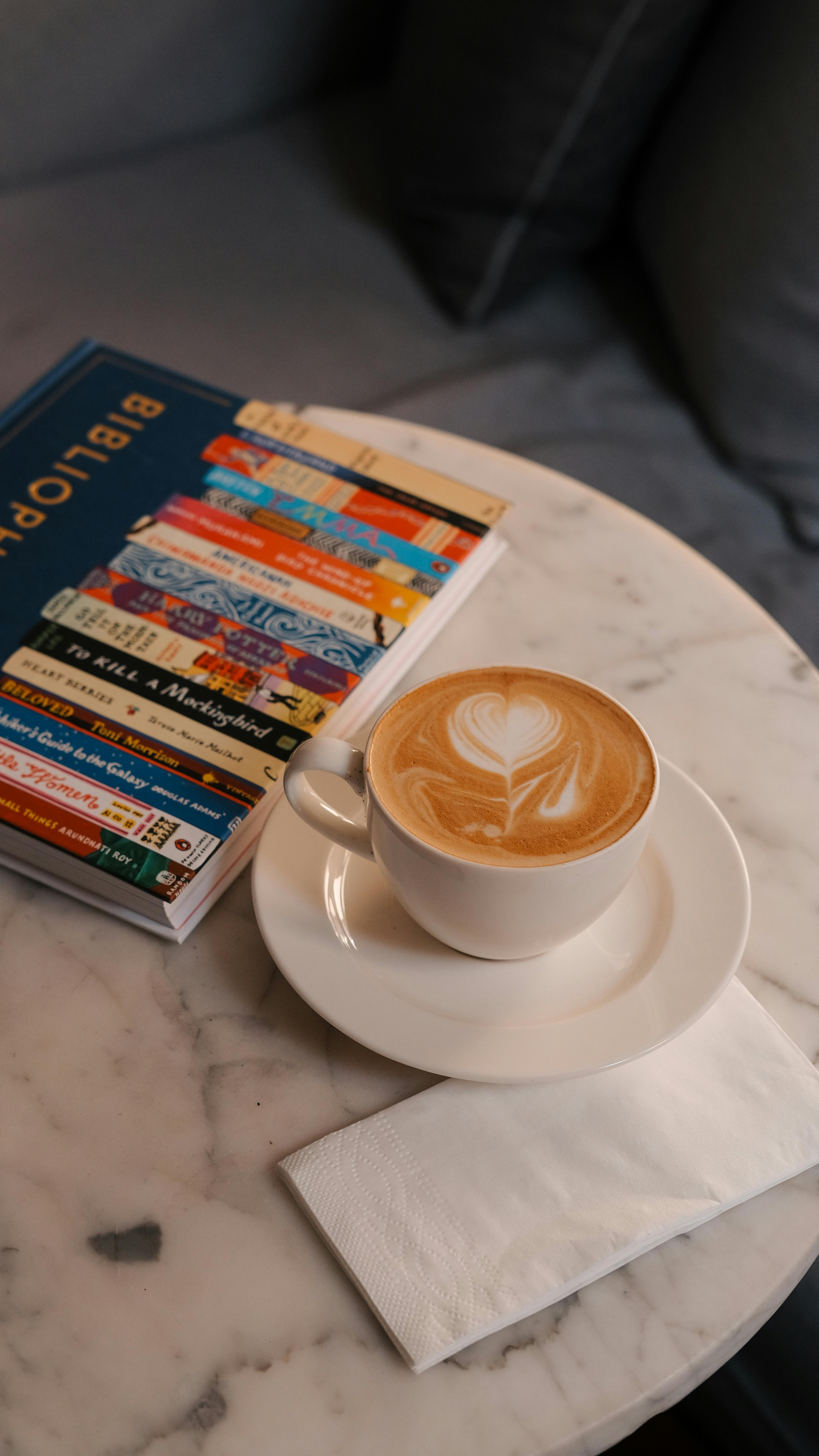 Latte Coffee and Book on Marble Table