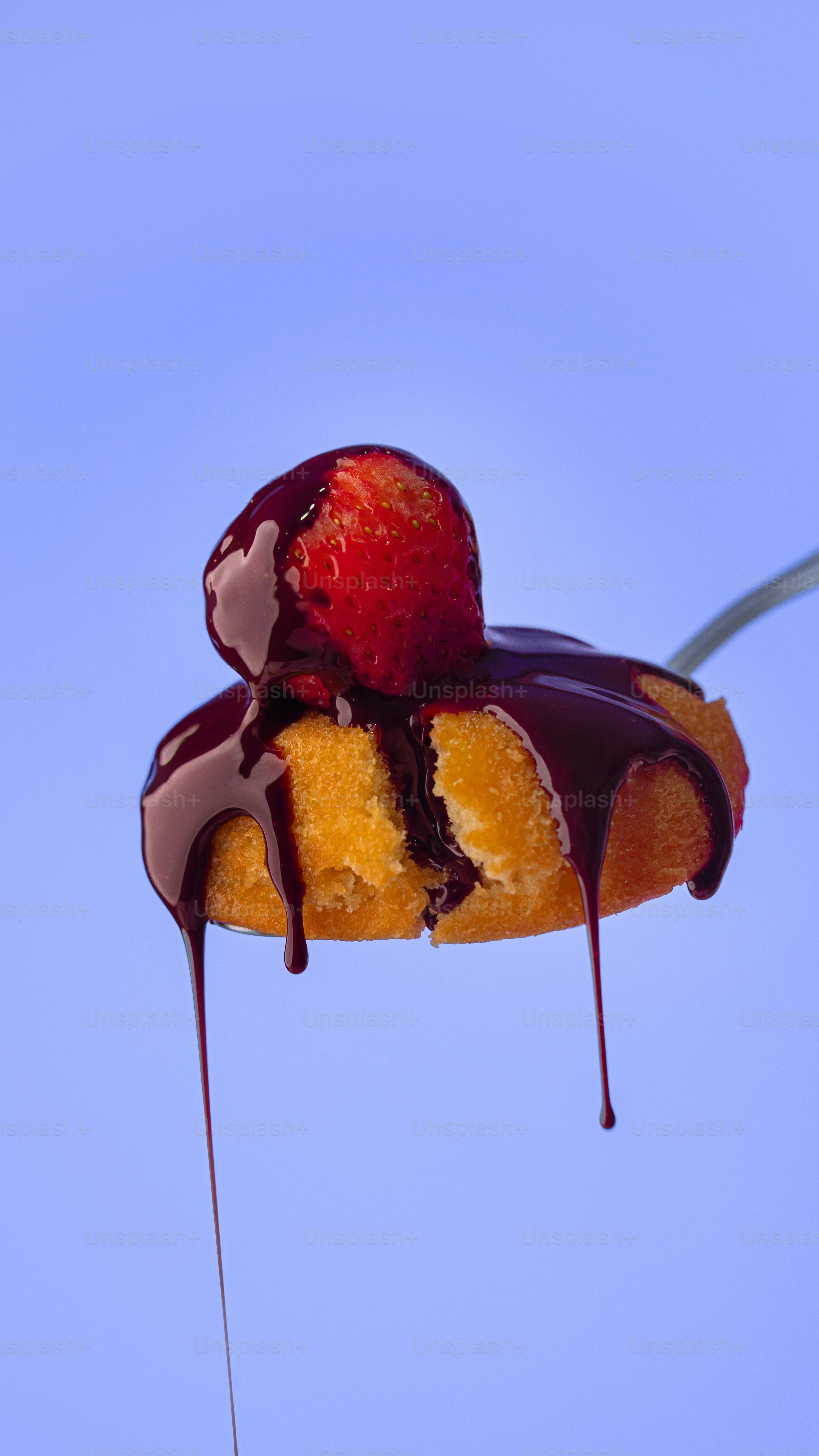 Dripping Chocolate Over Cake with Strawberry