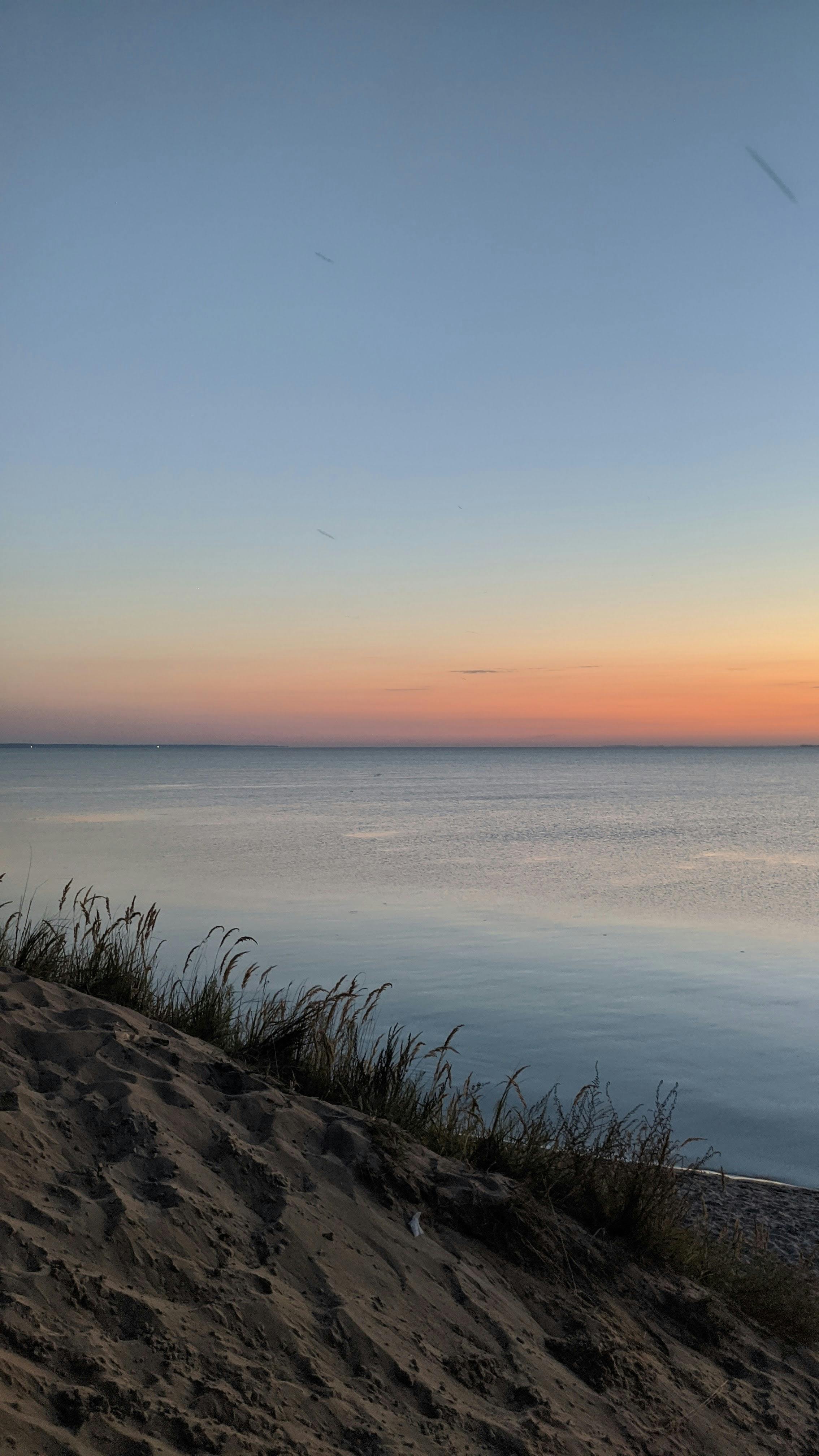 Sunset Over Calm Sea from Sand Dune
