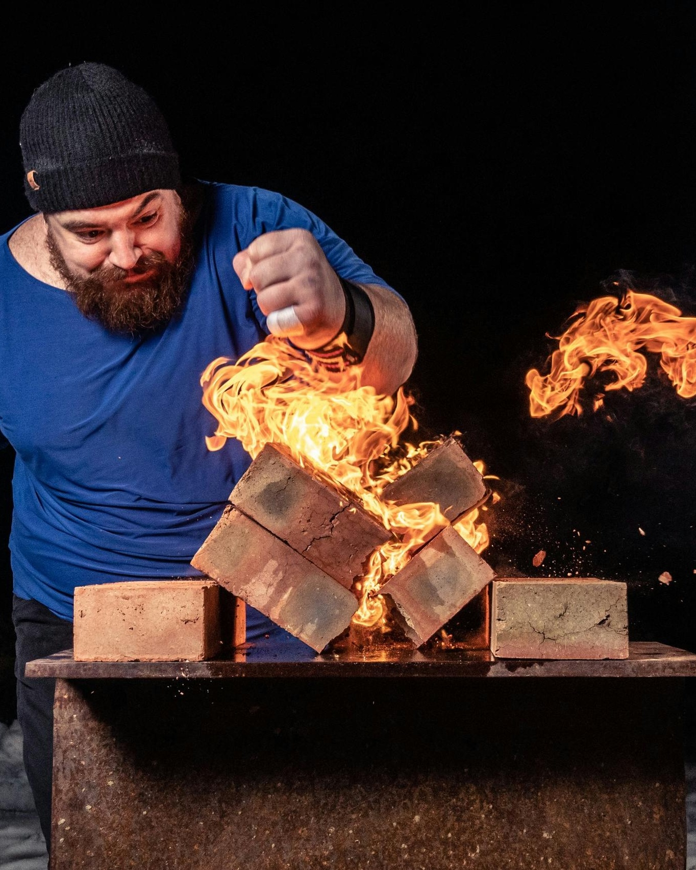 Strongman Breaking Flaming Bricks
