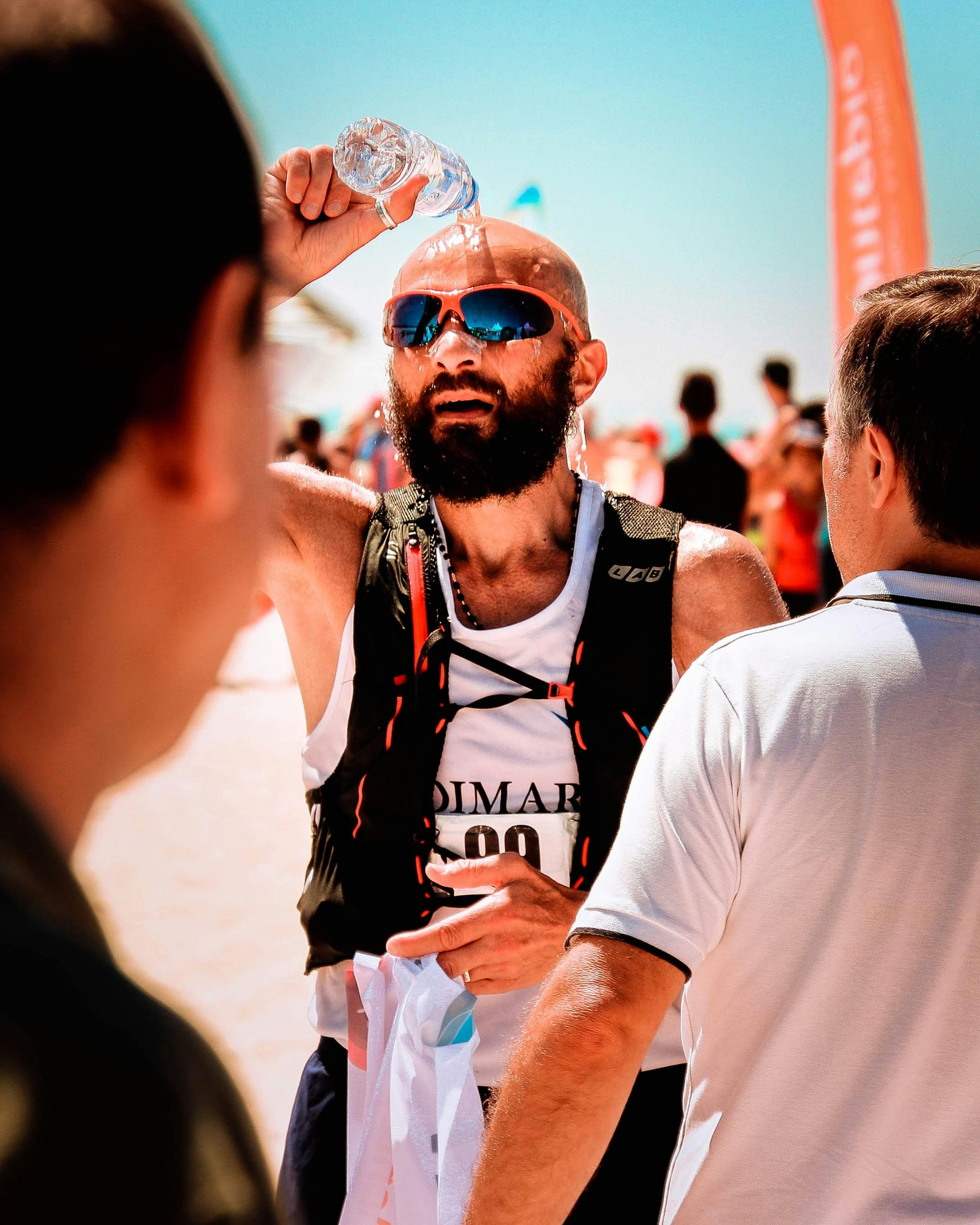 Marathon Runner Pouring Water on Head