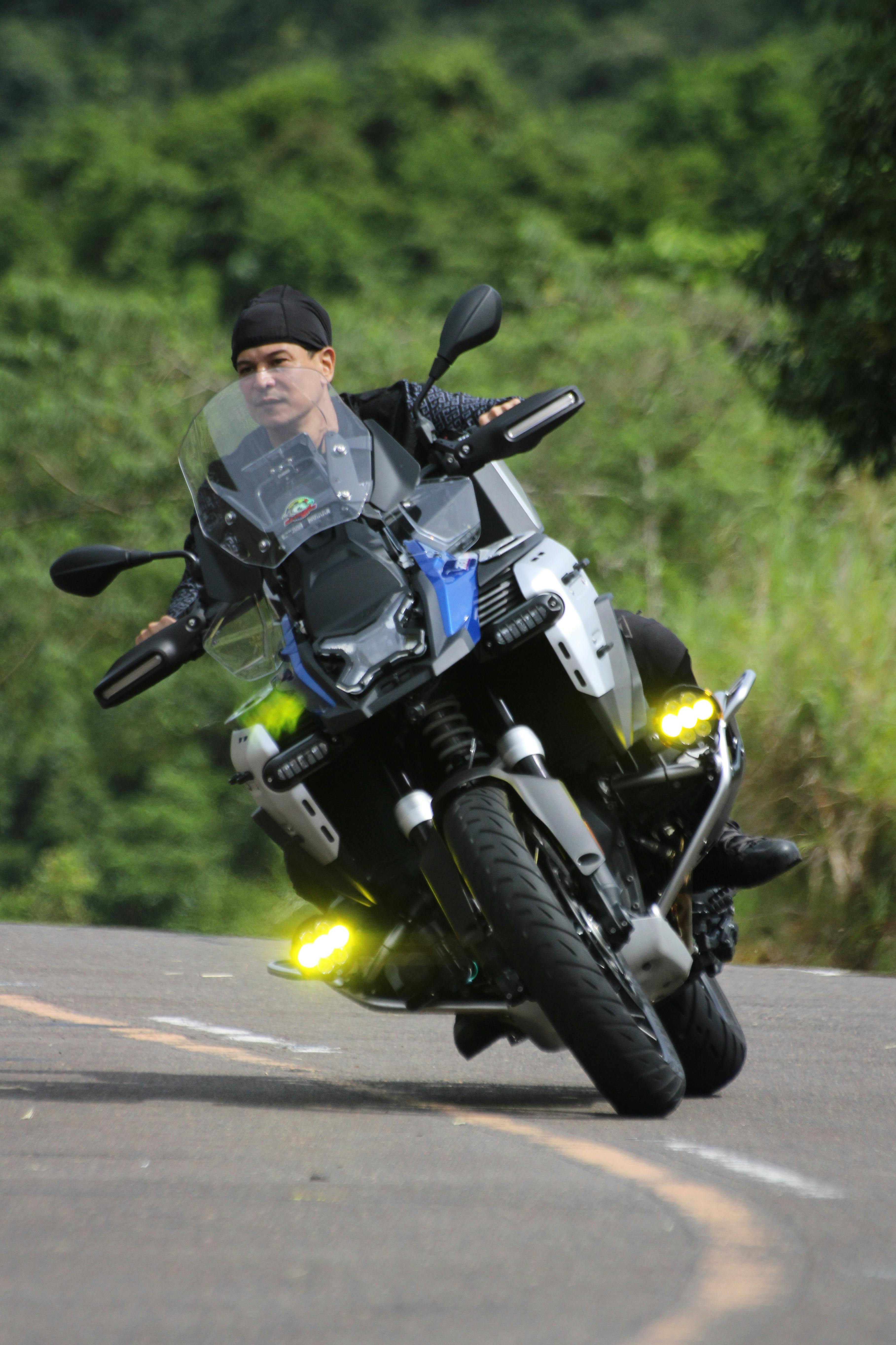 Motorcyclist Leaning Into Road Curve