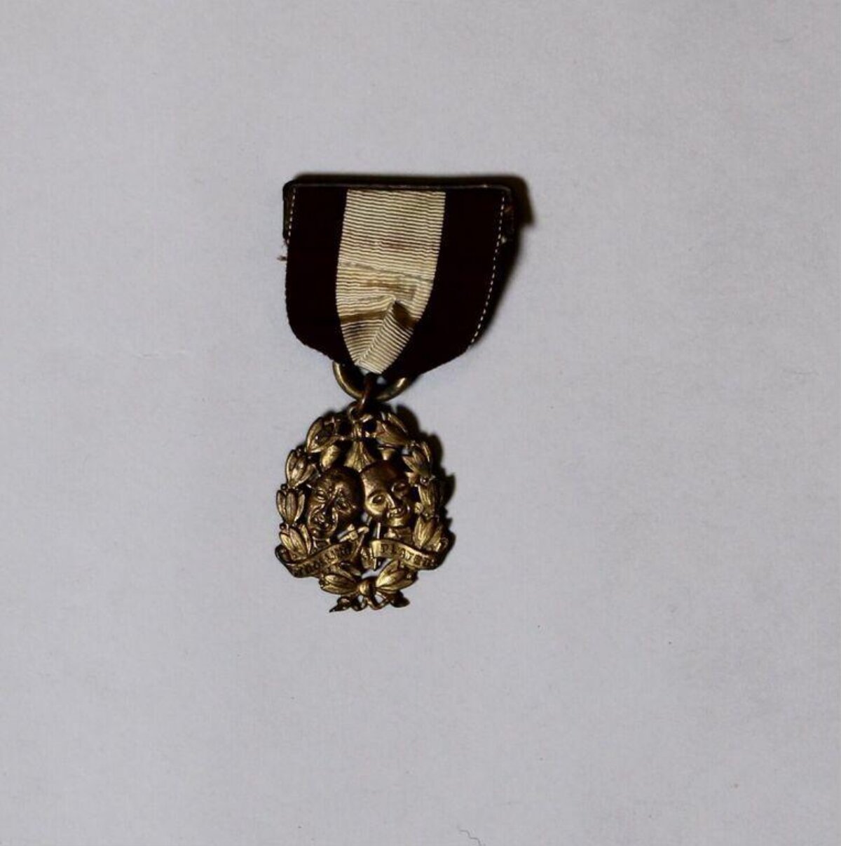 Antique Bronze Skull Medal — Logos