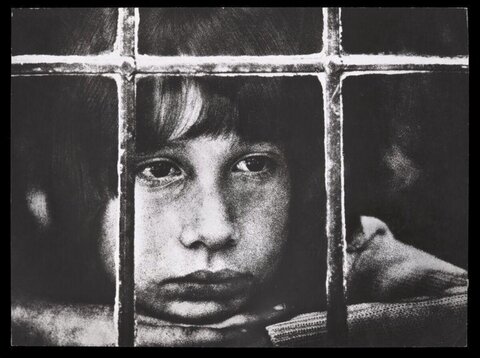 Child Behind Window Bars