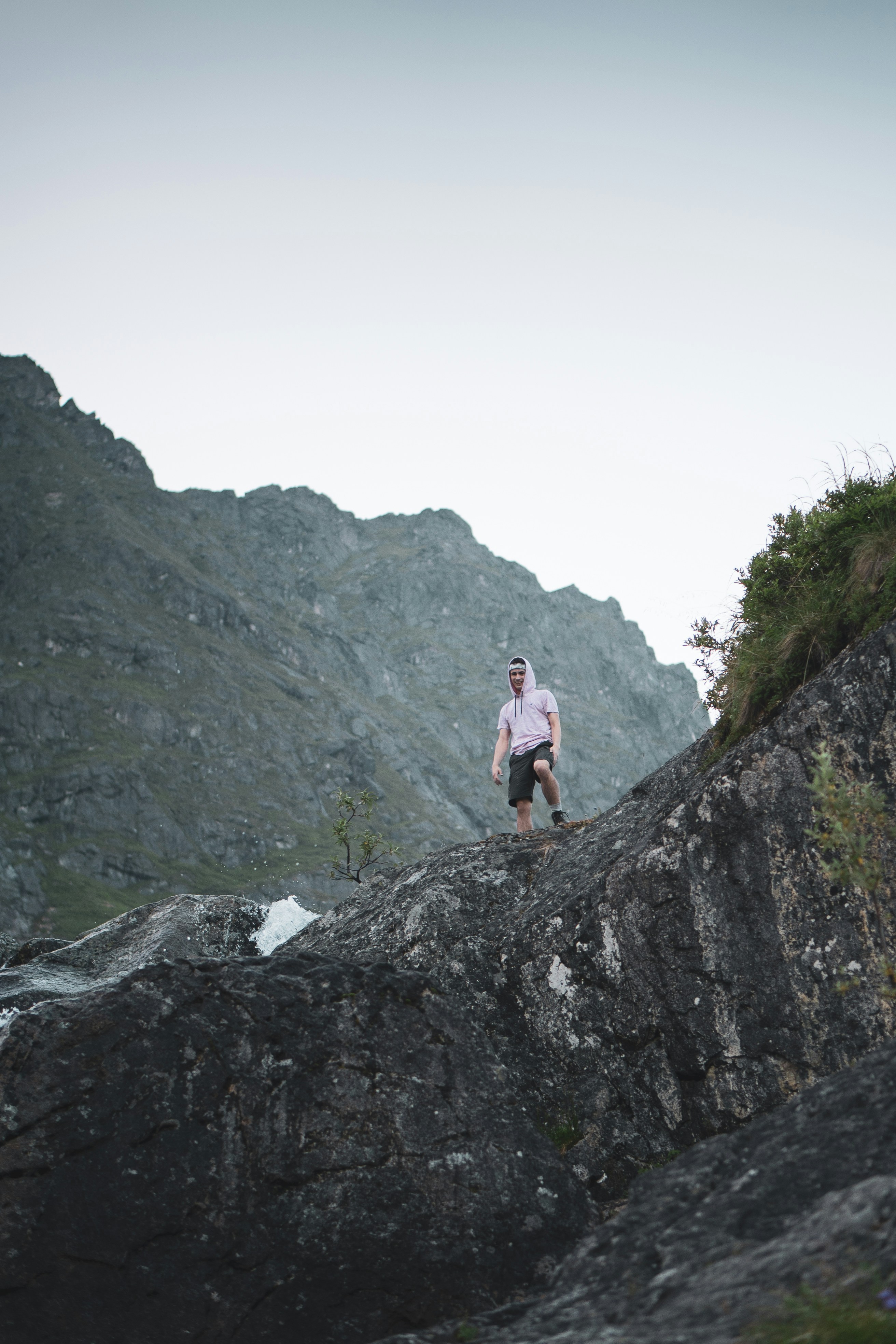 Hiker Standing on Mountain Rock