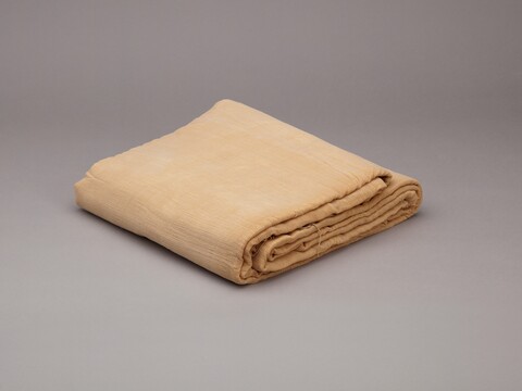 Folded Light Tan Blanket