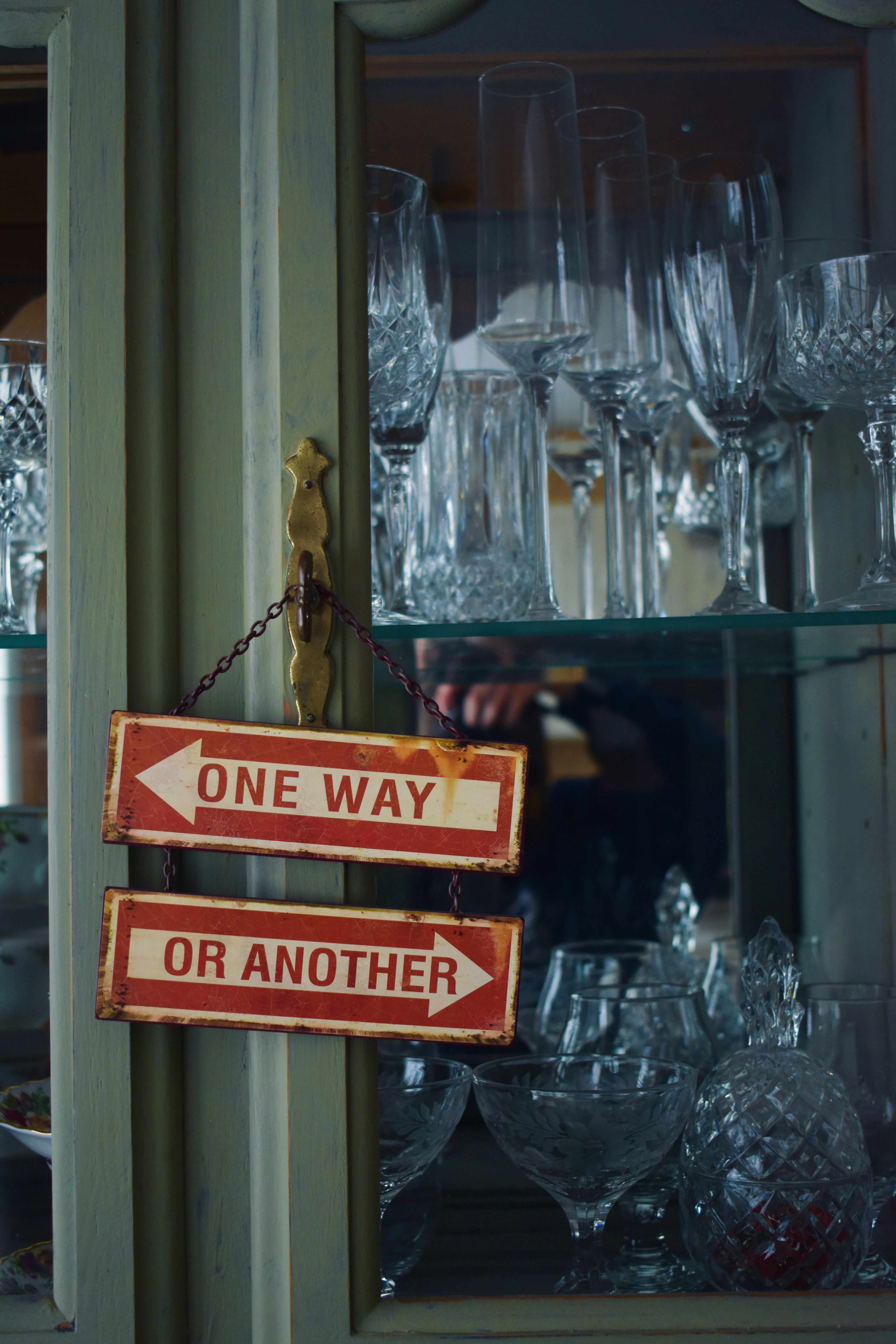 One Way Or Another Sign on Glass Cabinet
