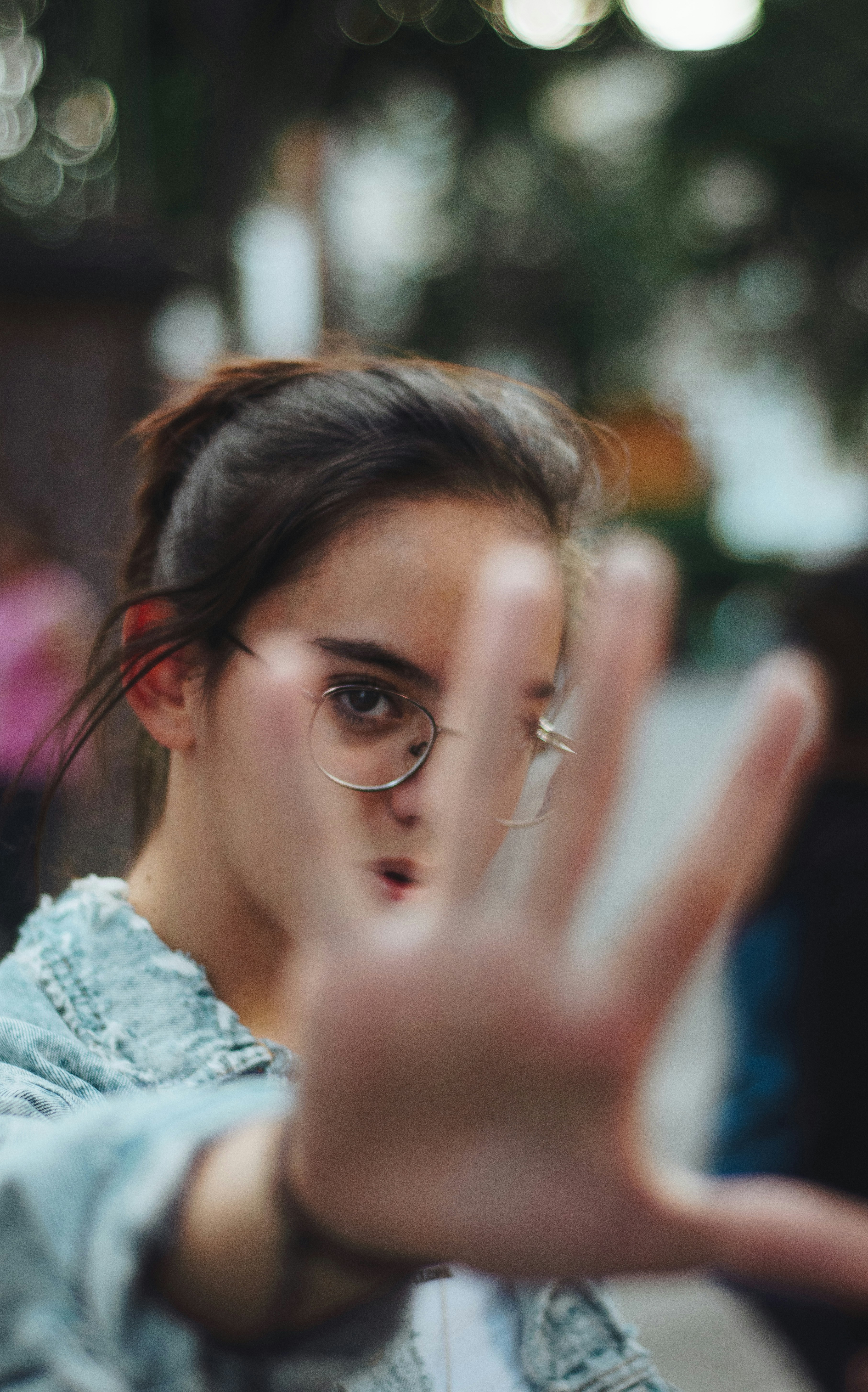 Girl Reaching Hand Toward Camera