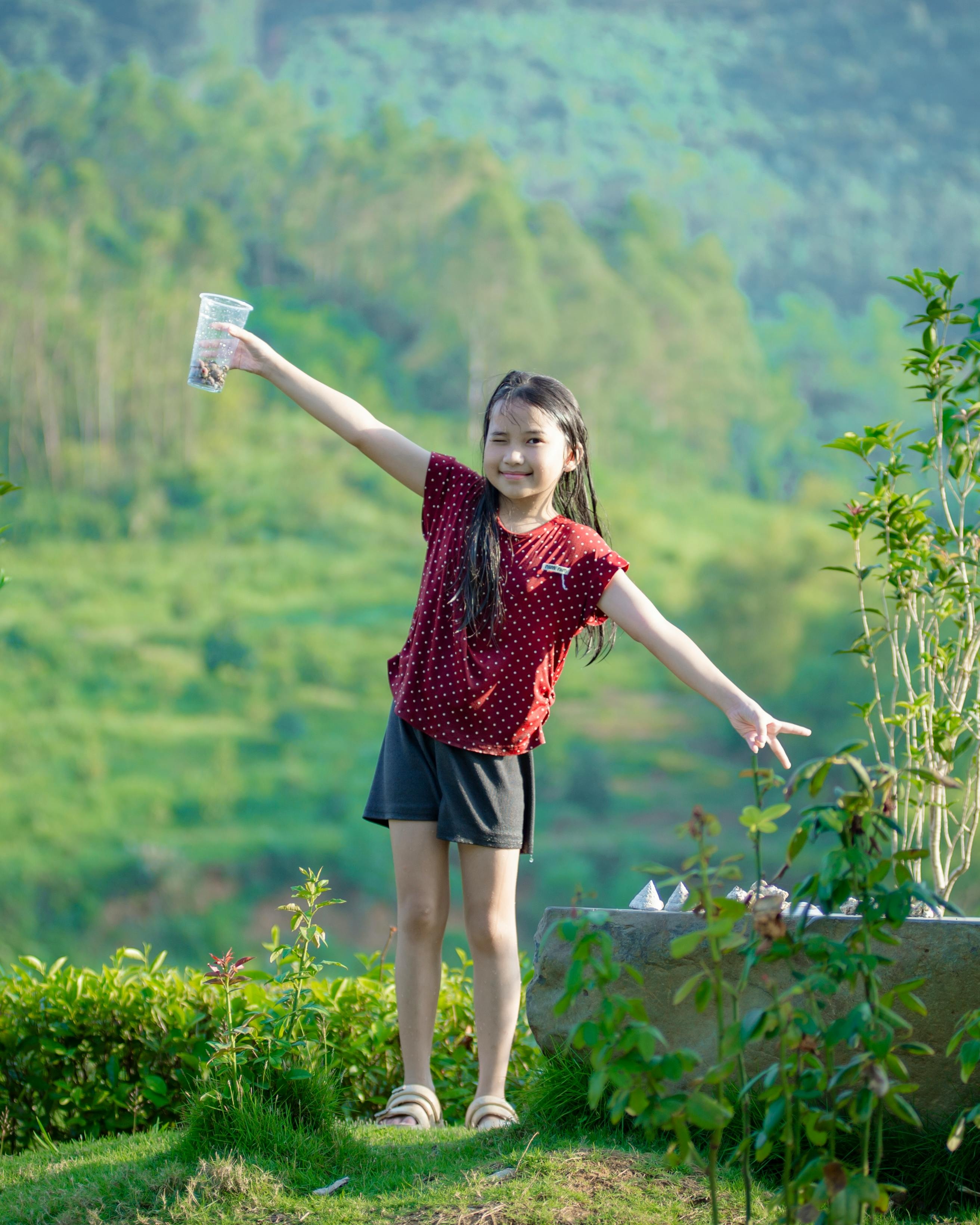 Happy Girl on Green Hillside