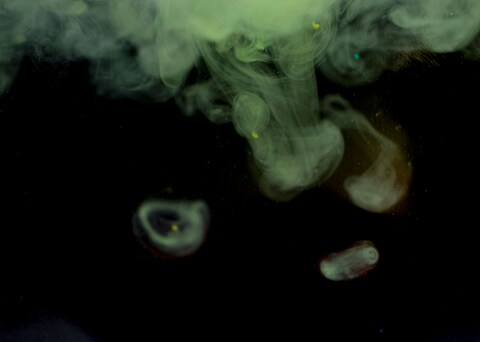 Green Ink Smoke on Black Background