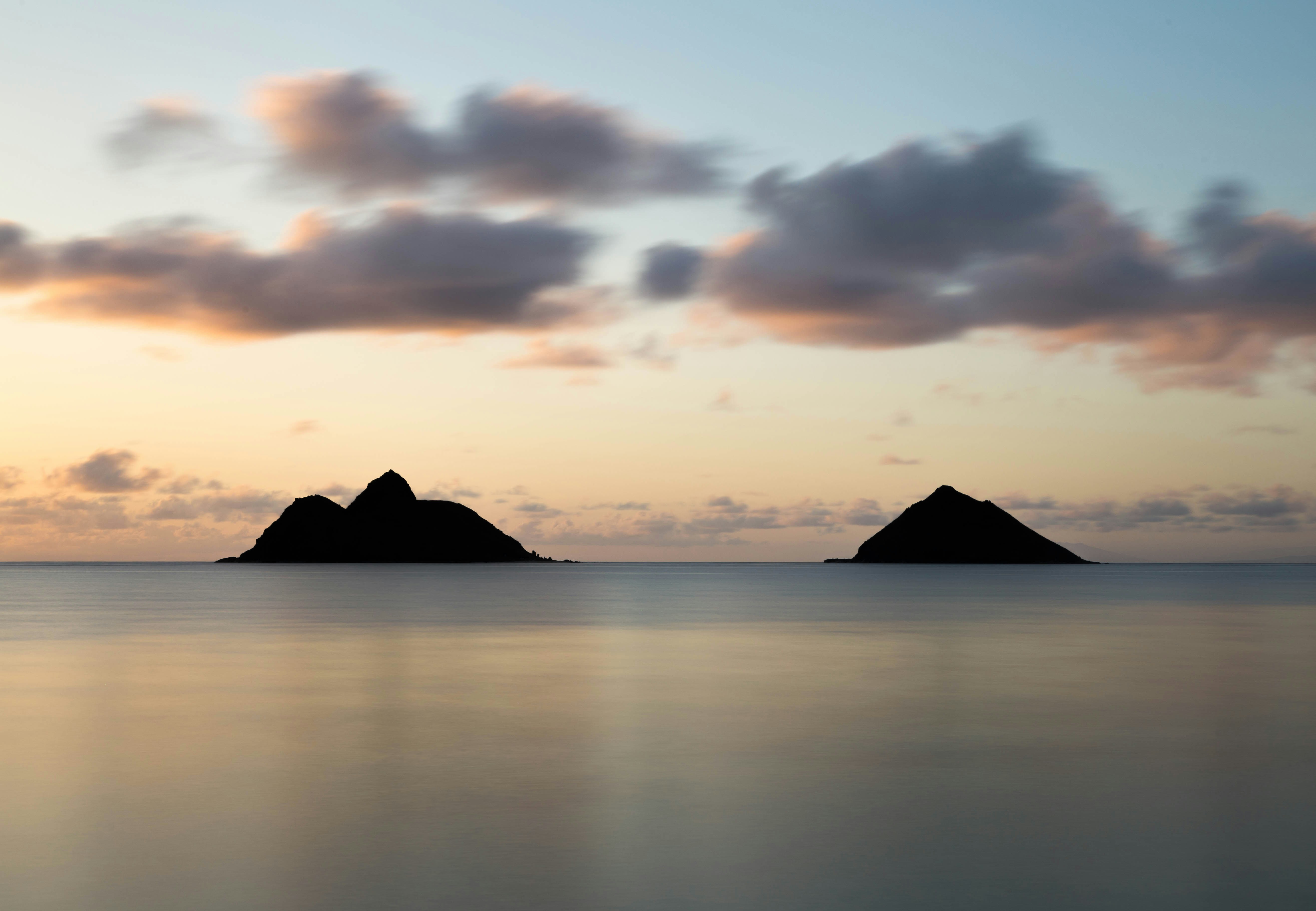 Two Islets on Calm Sea at Sunrise