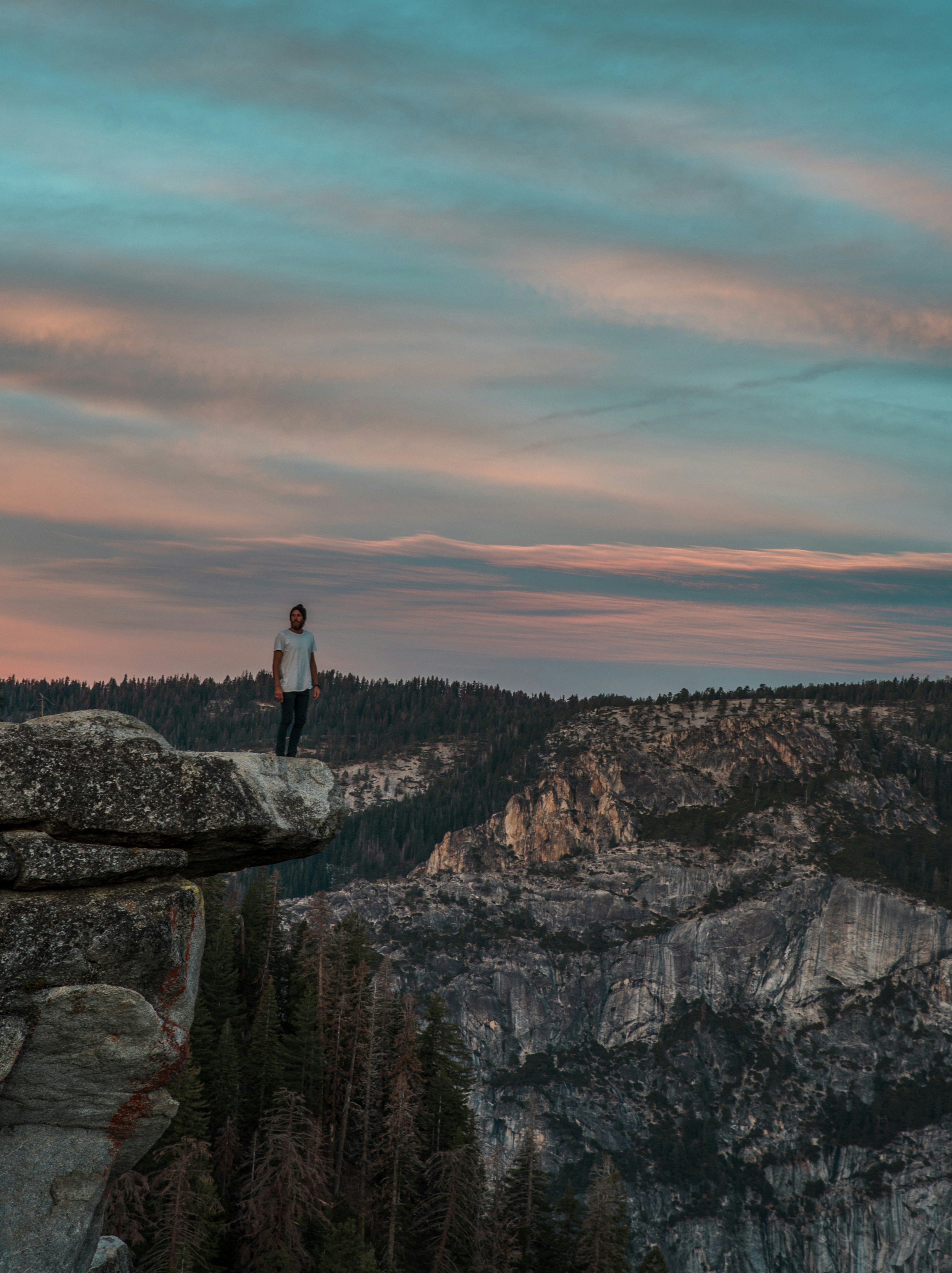 Man on Cliff Overlook at Twilight