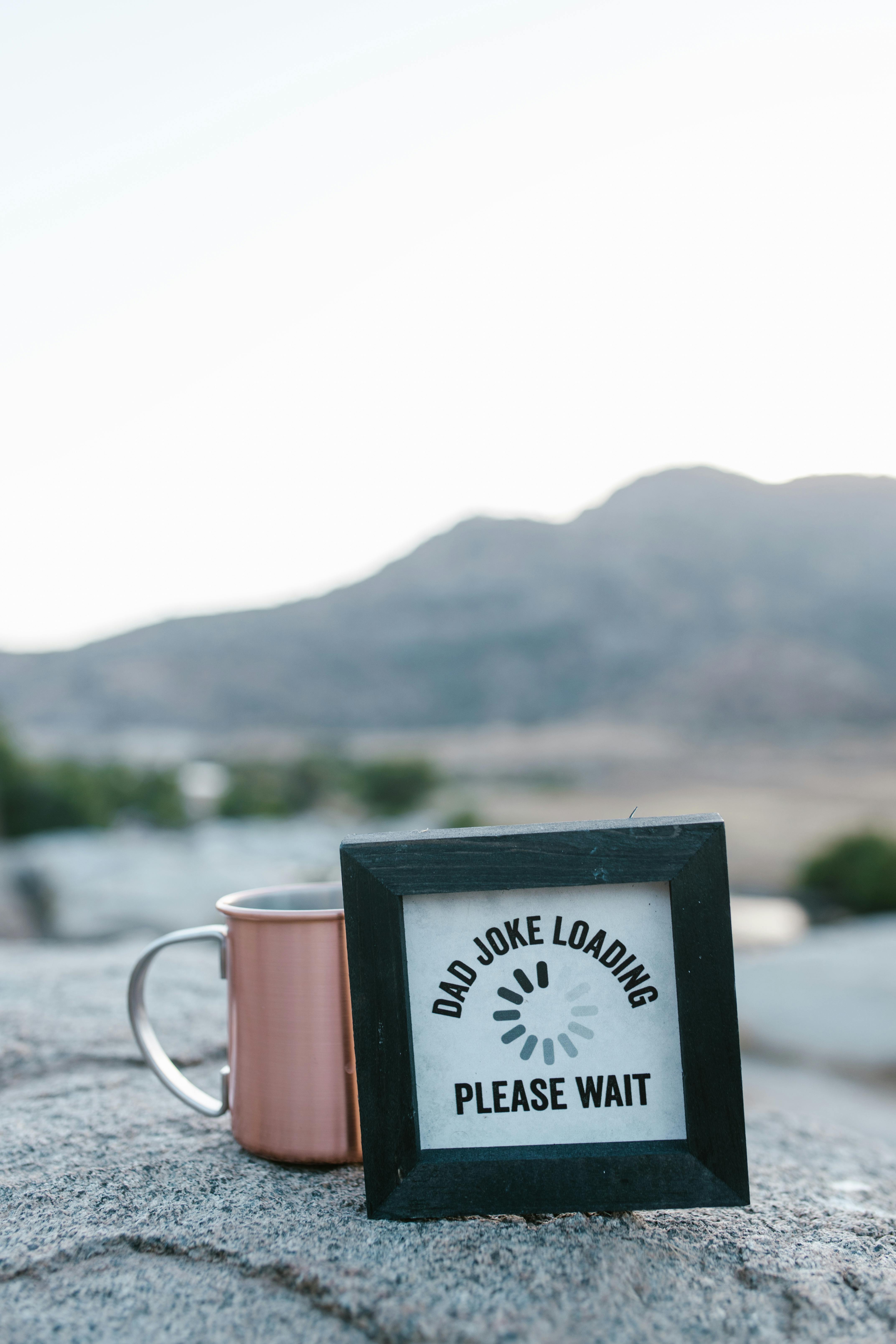 Dad Joke Sign And Copper Mug Outdoors