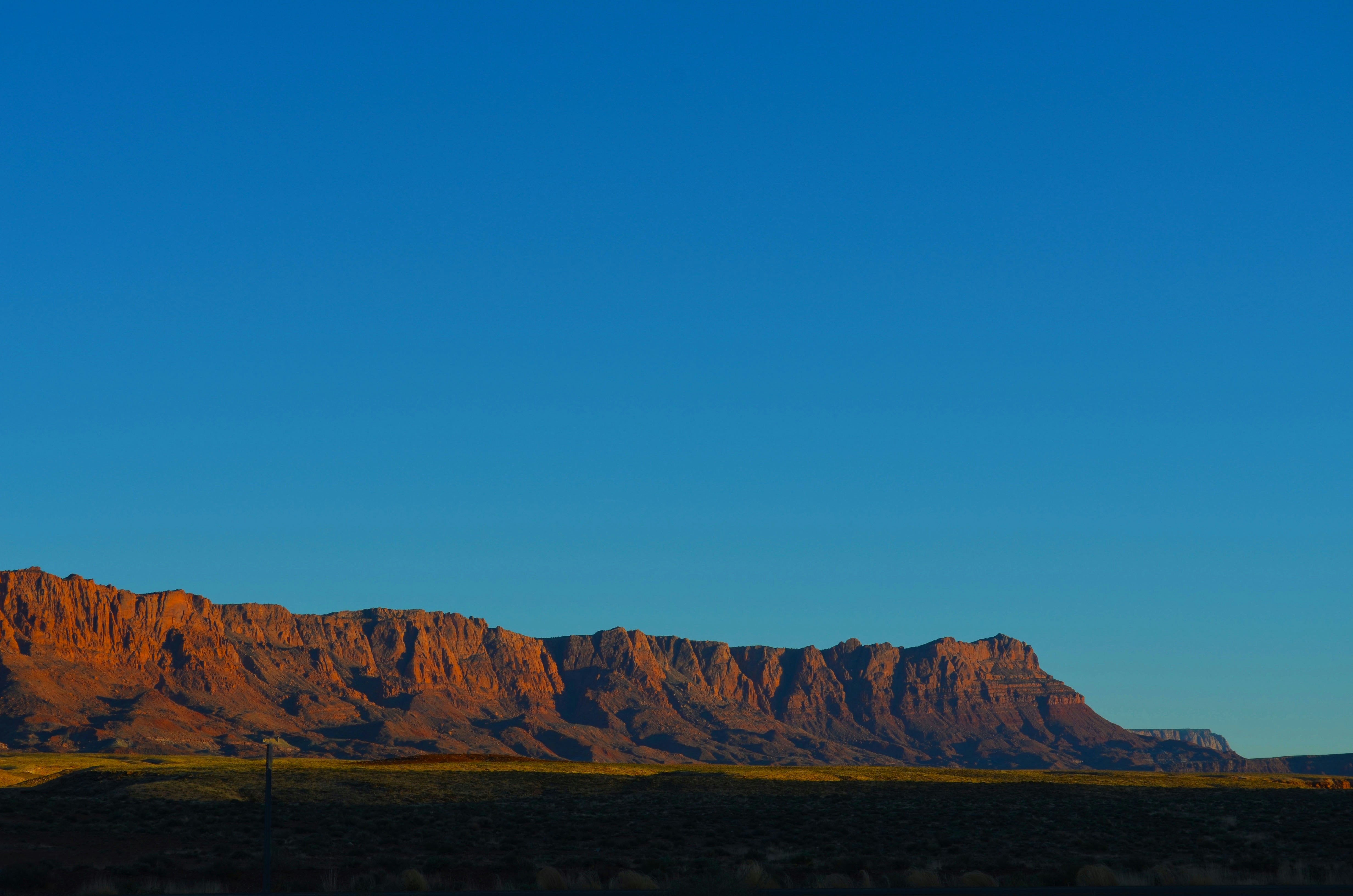 Red Cliffs Under Clear Blue Sky