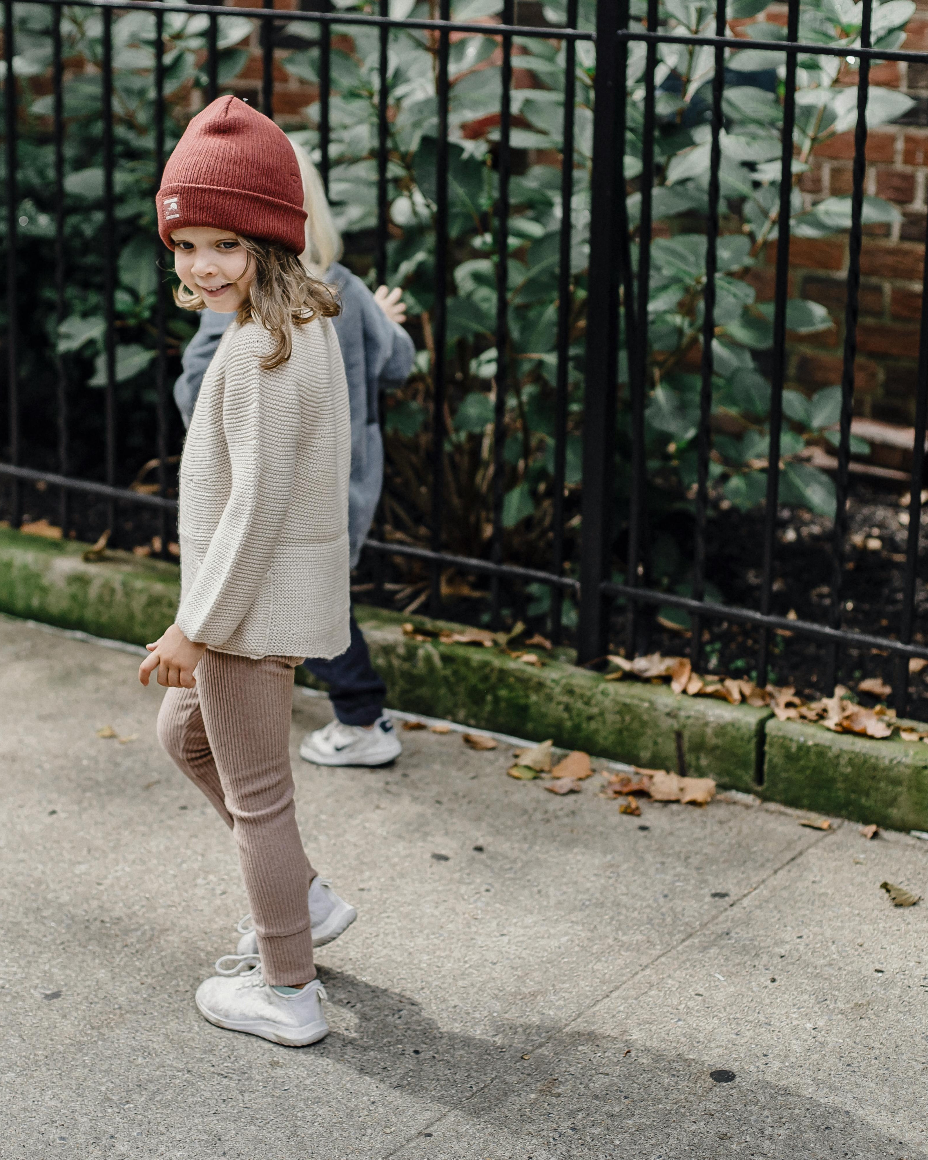 Young Girl on Autumn Sidewalk