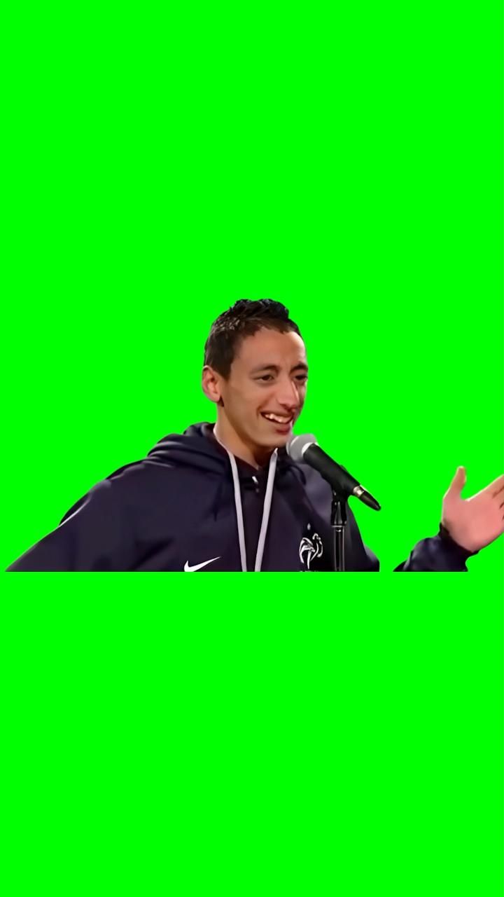 Smiling Man at Microphone on Green Screen