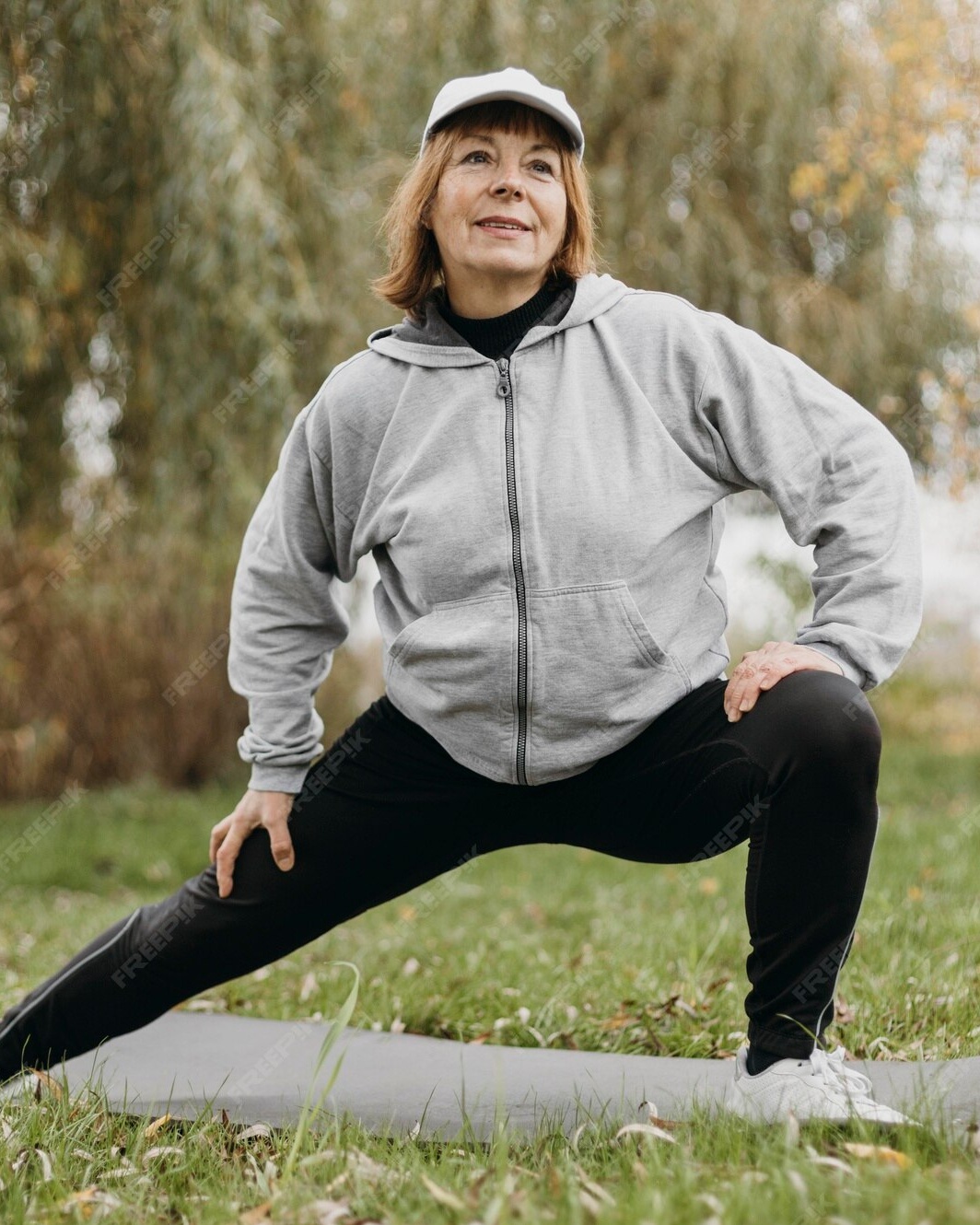 Senior Woman Stretching Outdoors