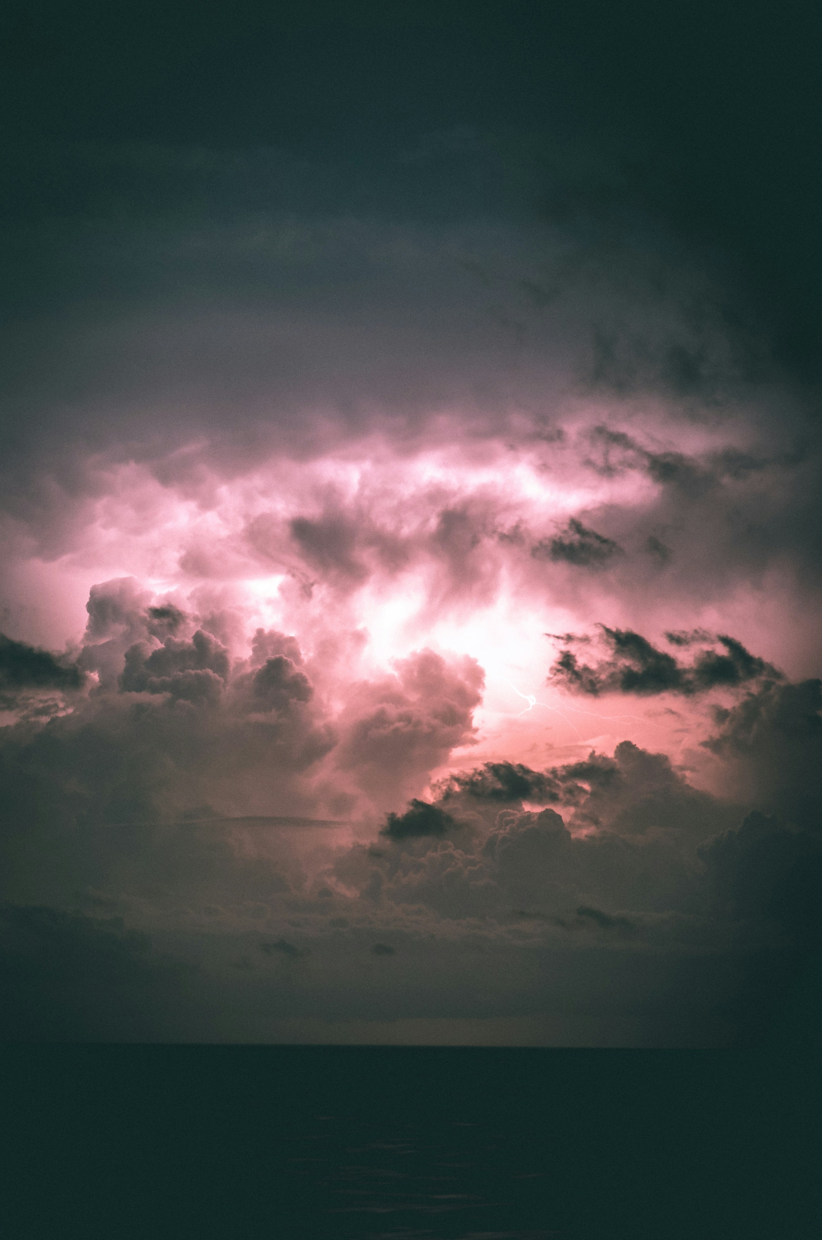 Pink Lightning Storm Over Sea