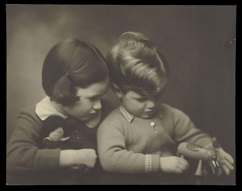 Two Children Playing With Toys