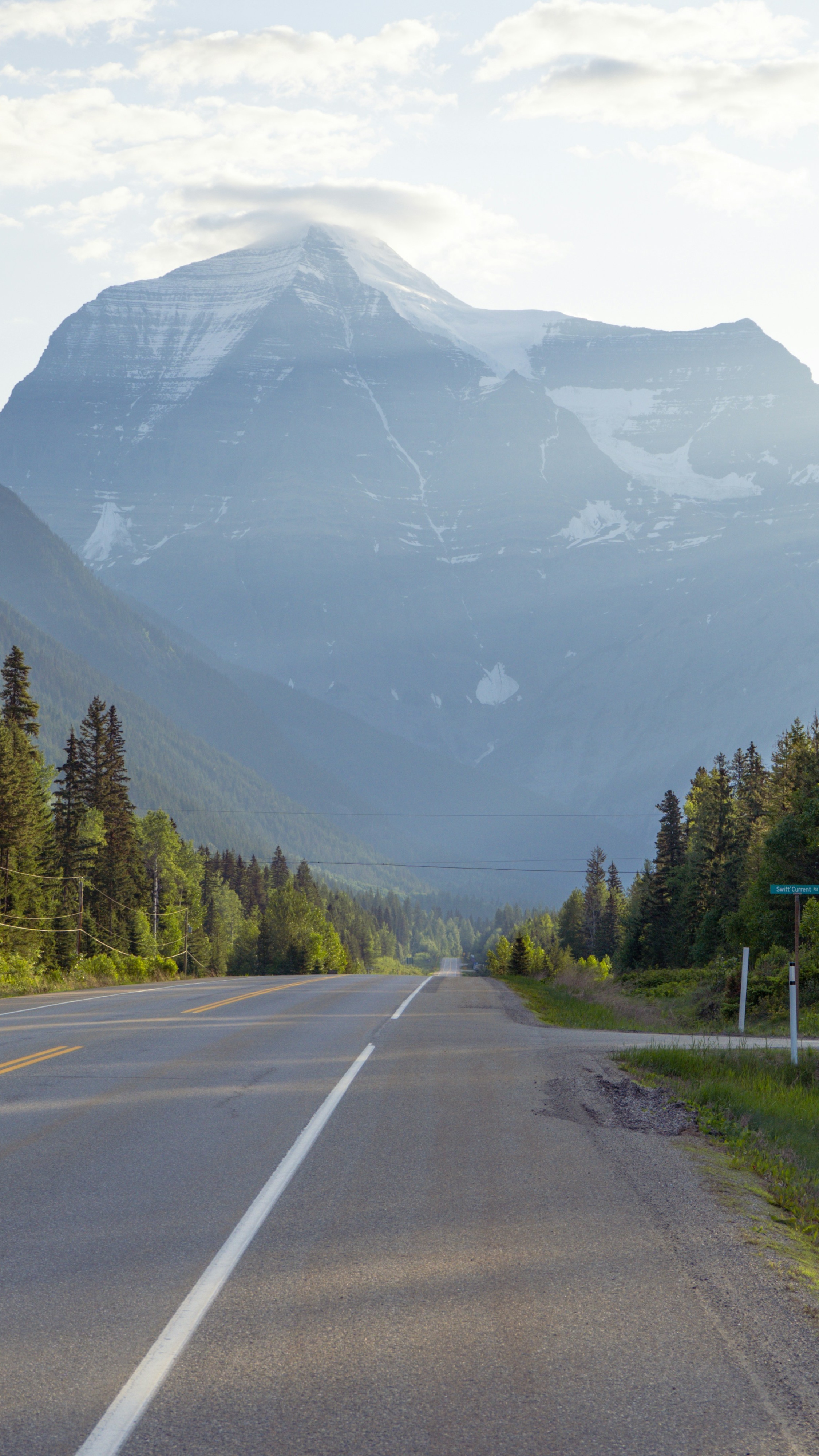 Highway Leading to Snow-Capped Mountain