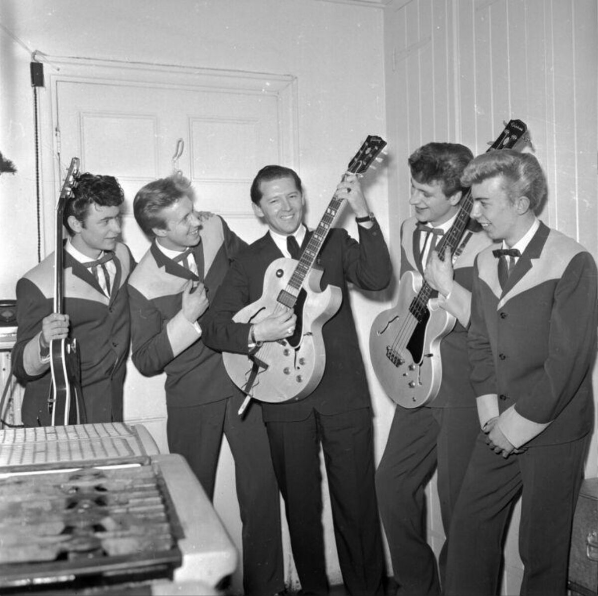 Vintage Band Posing With Guitars