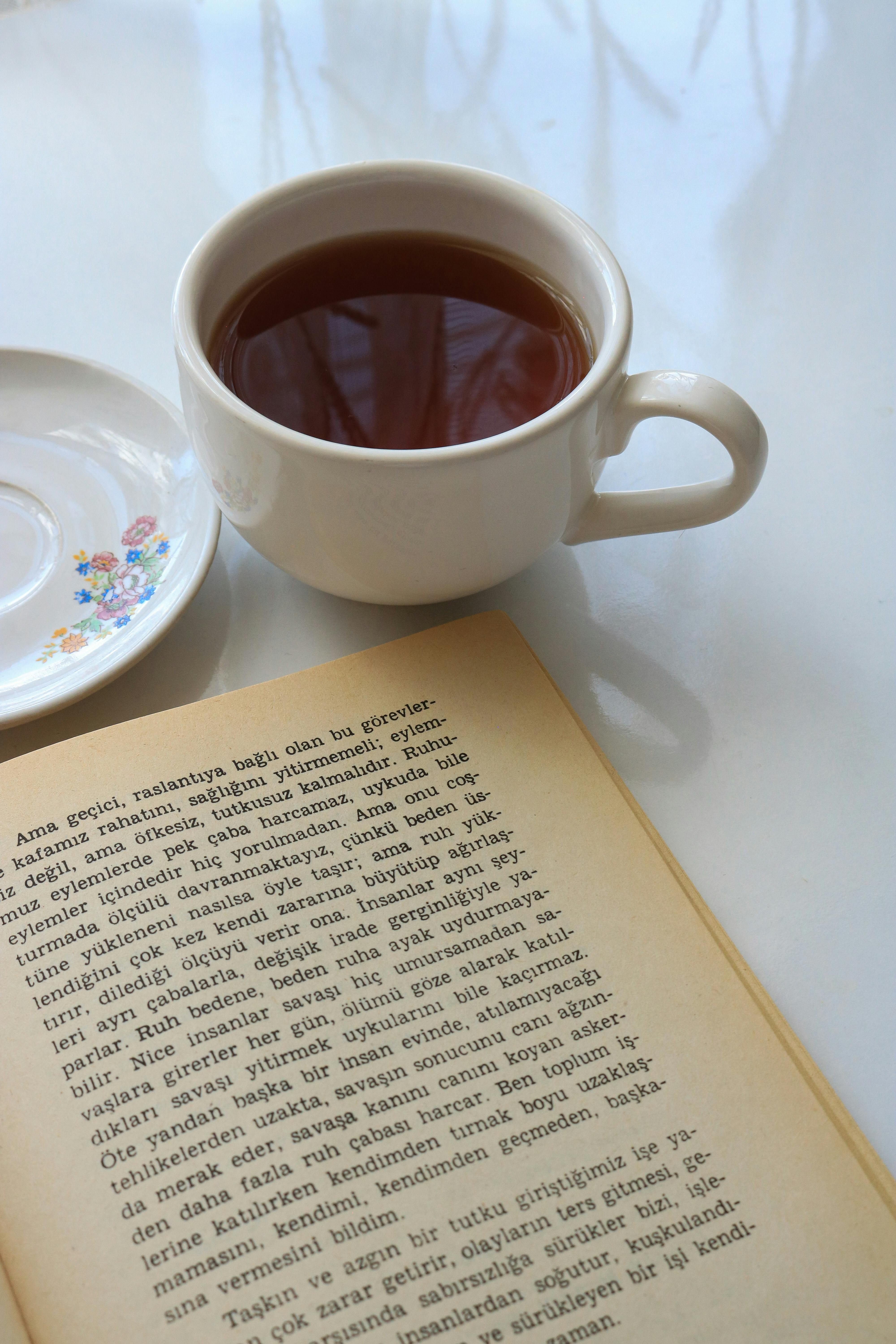Cup of Tea with Open Turkish Book