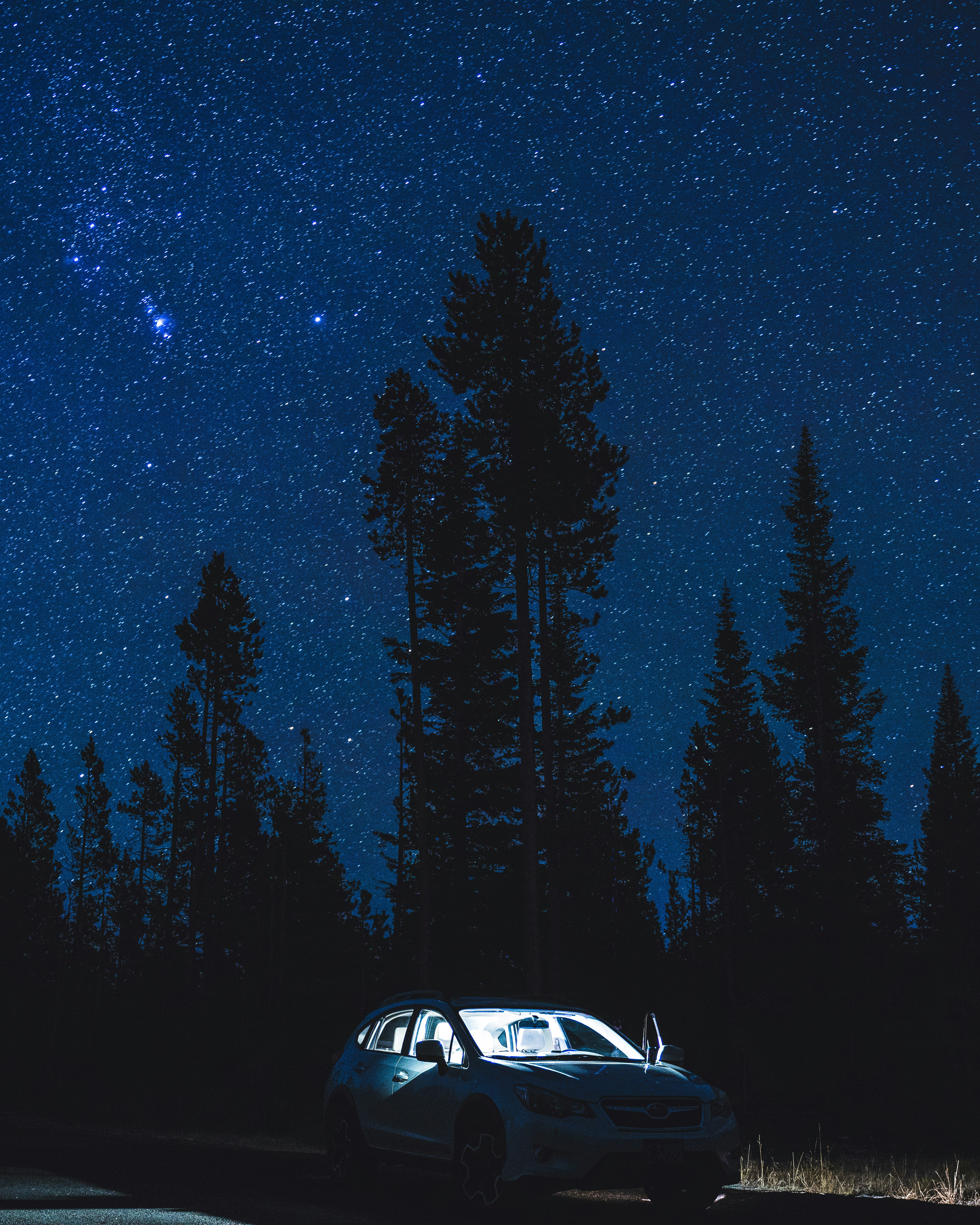 Parked Car Under Starry Night Sky