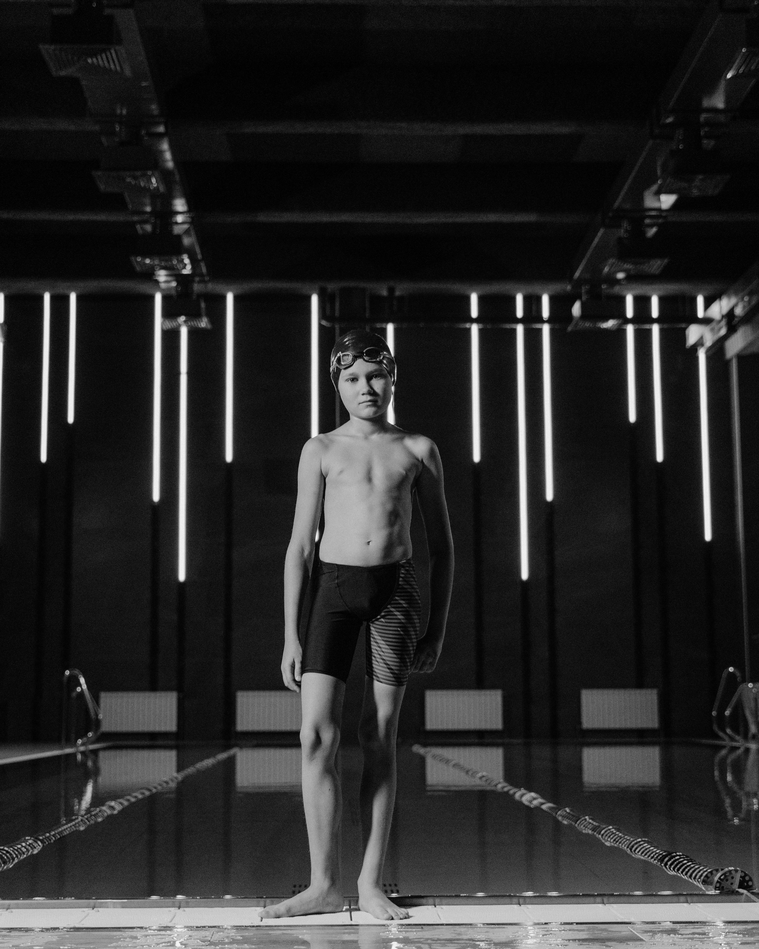 Young Swimmer at Indoor Pool