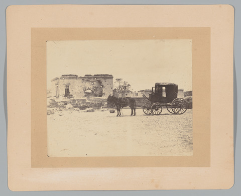 Horse-drawn Carriage Before Damaged Building