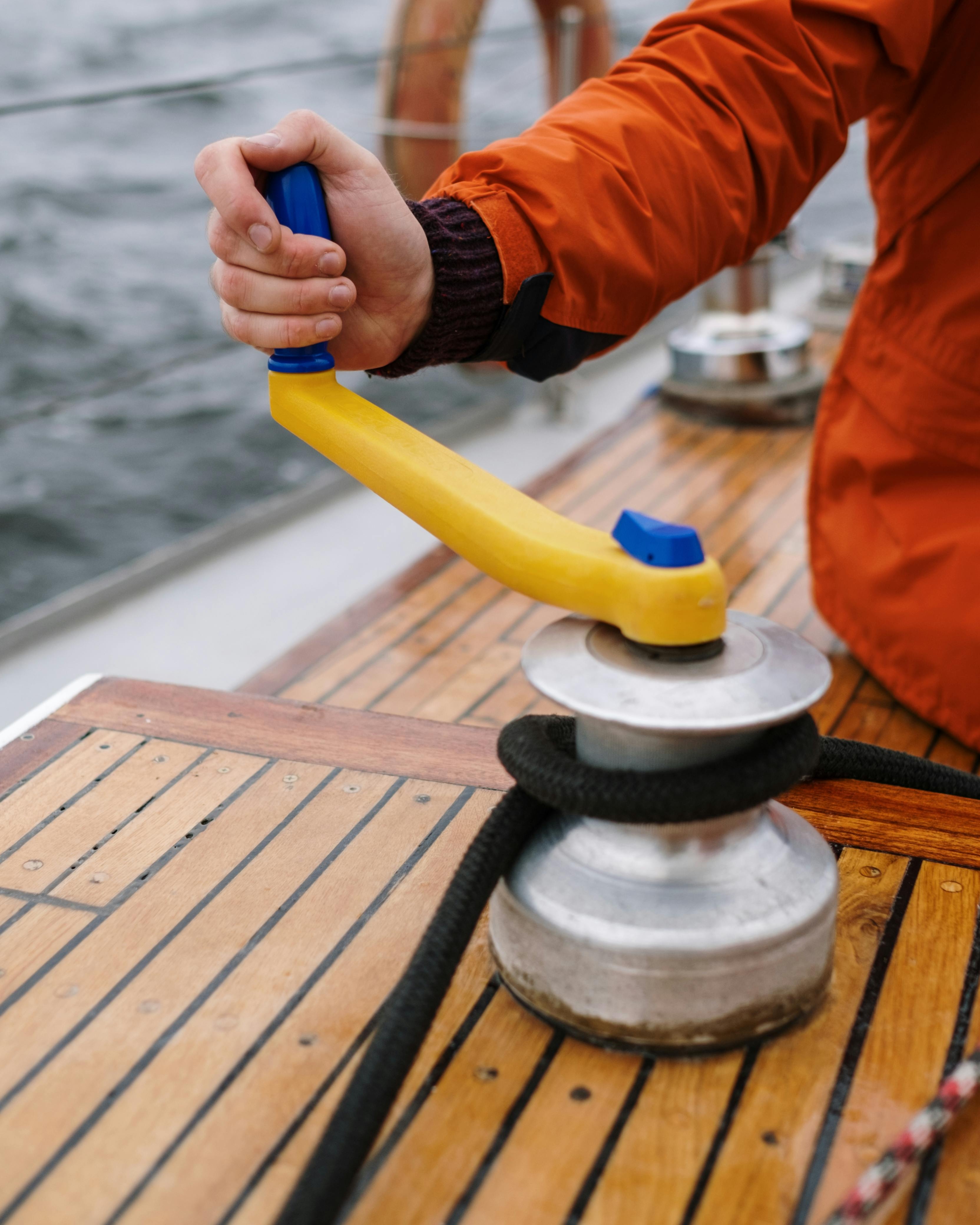 Sailor Operating Sailboat Winch